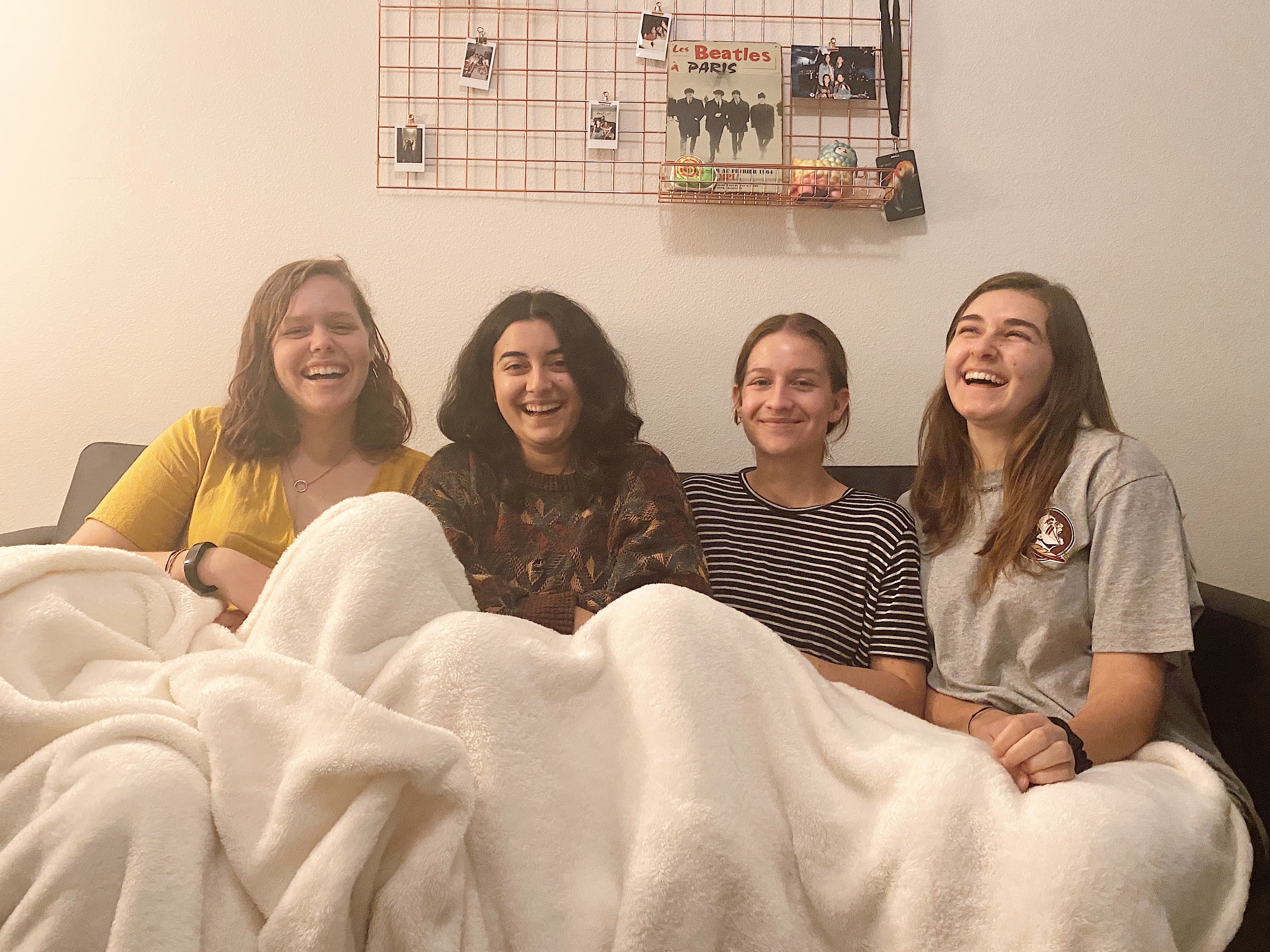 4 girls sitting on a couch