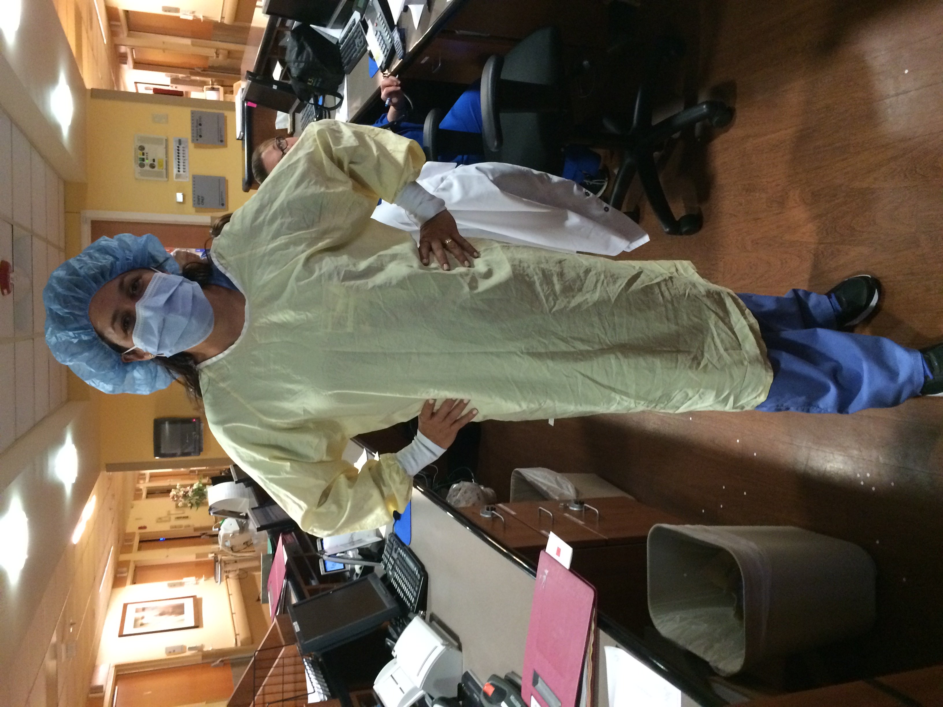 Nurse in scrubs and mask