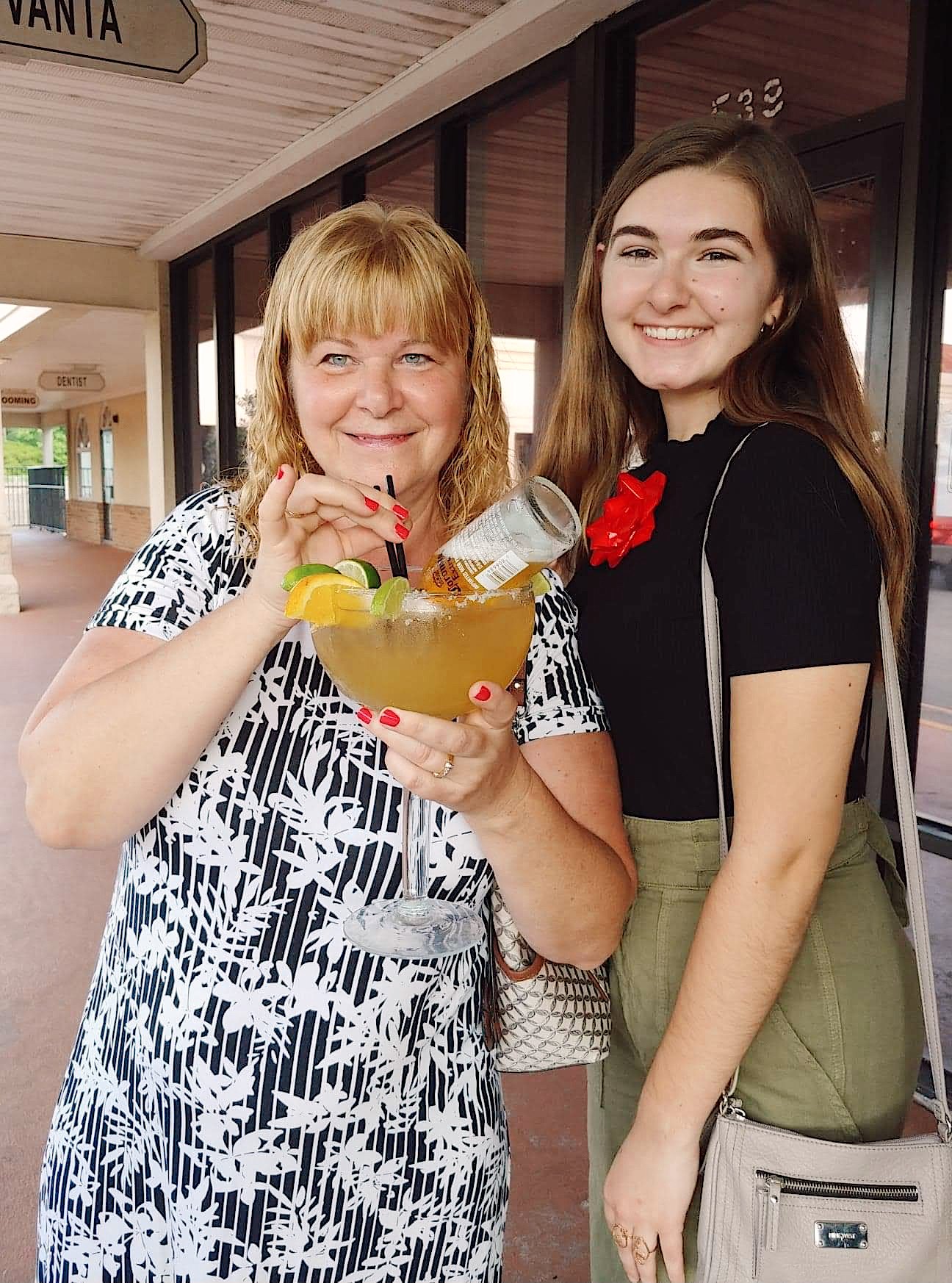 two women with a margarita