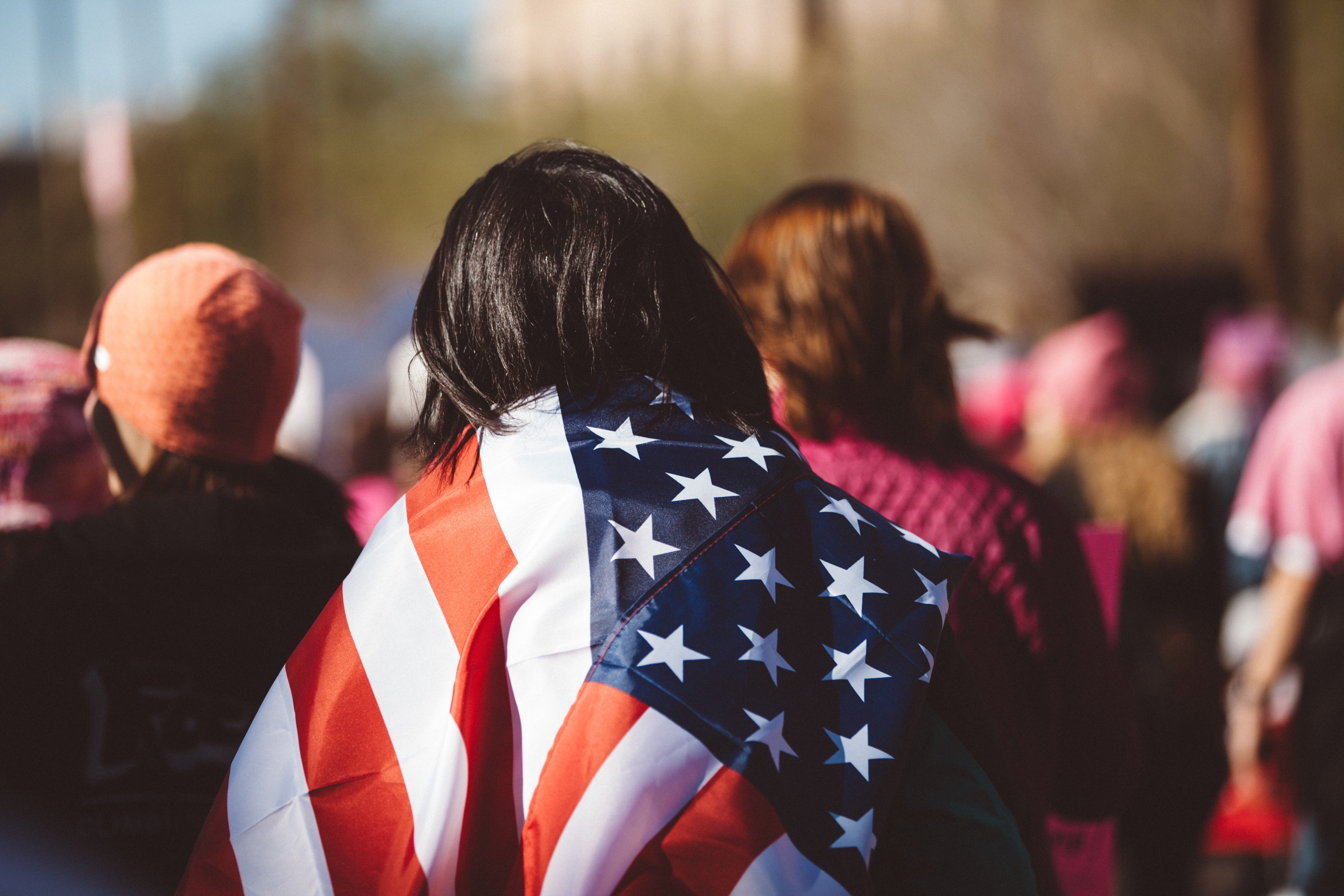 Girl with flag over her shoulders