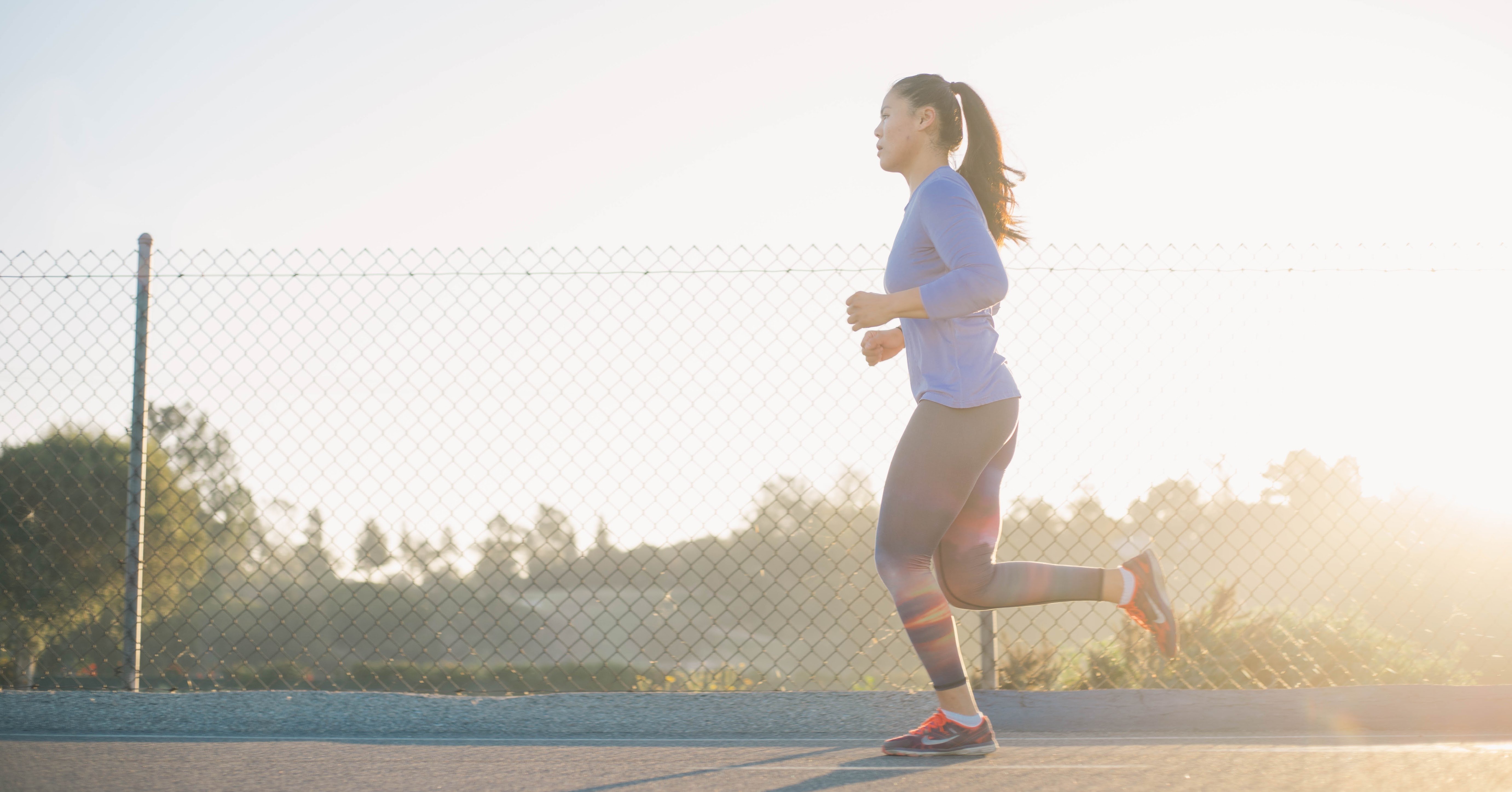 Woman running on pathway