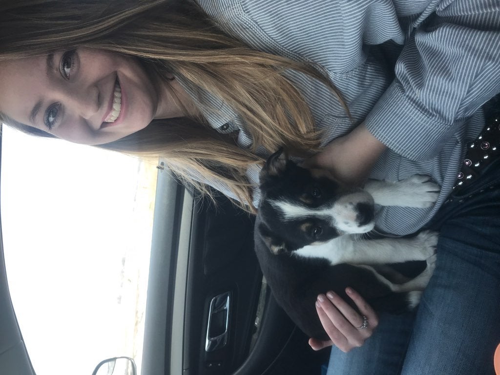 Girl holding puppy
