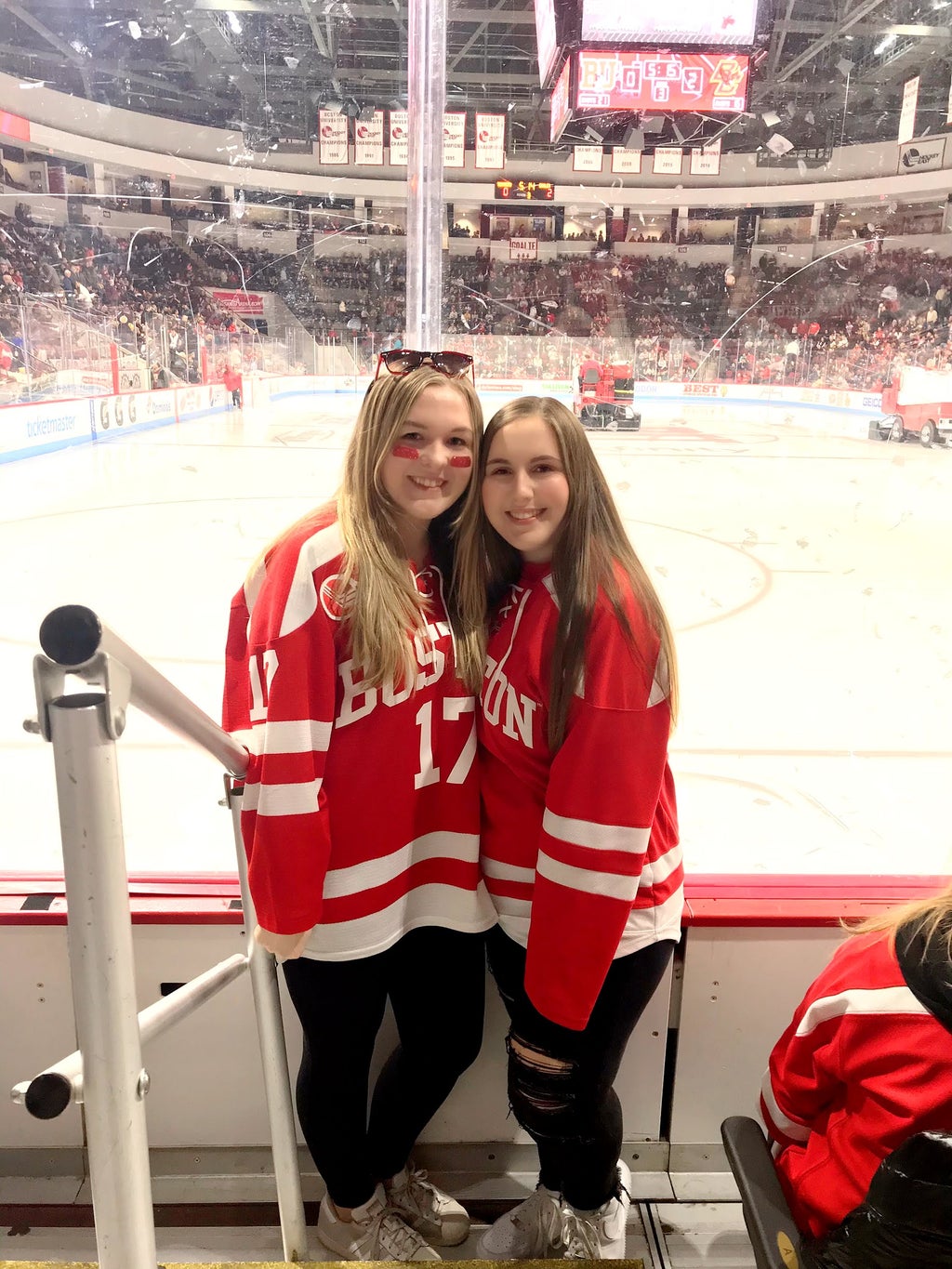 friends at a Boston University hockey game