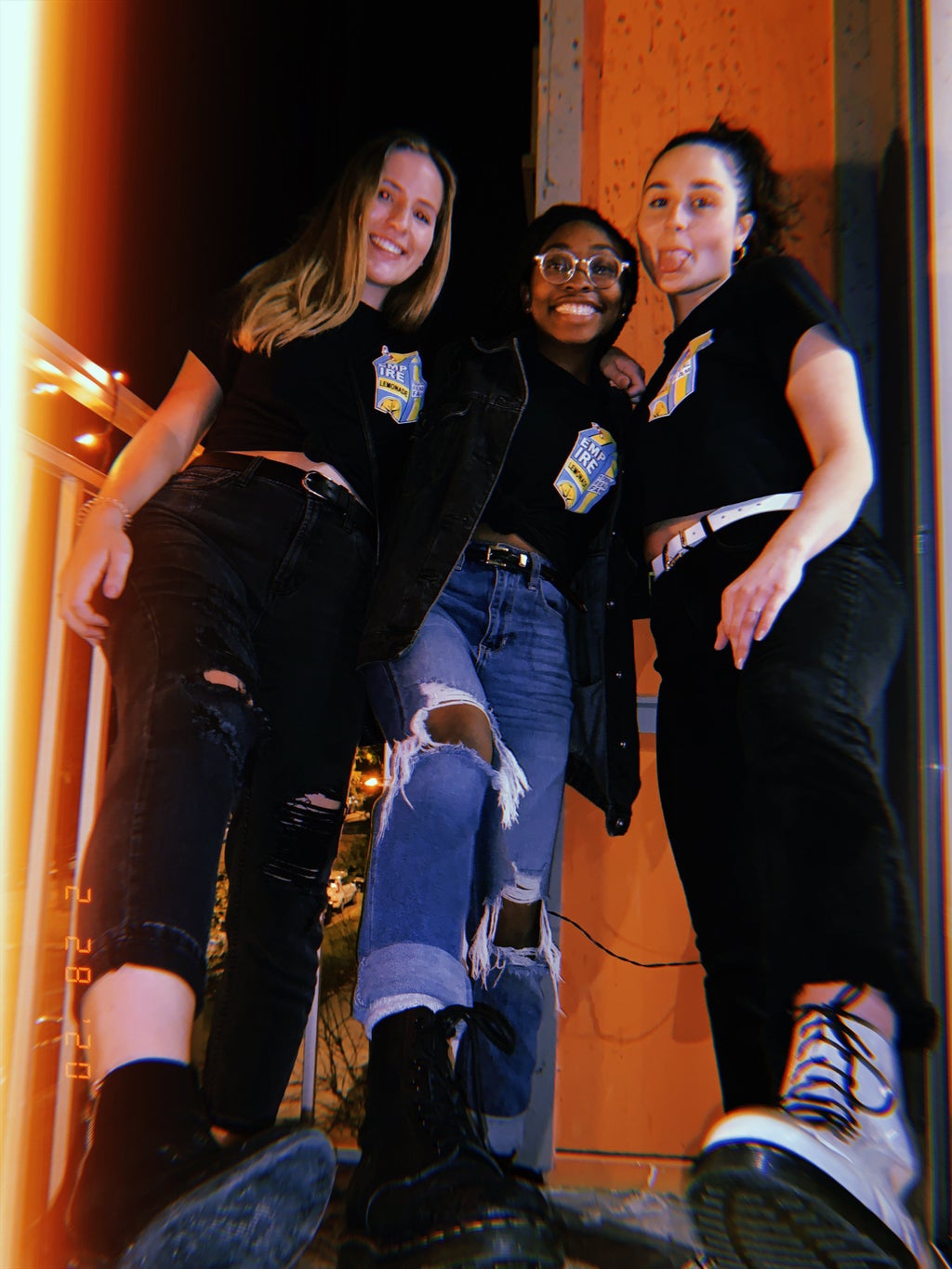 3 friends posing with boots