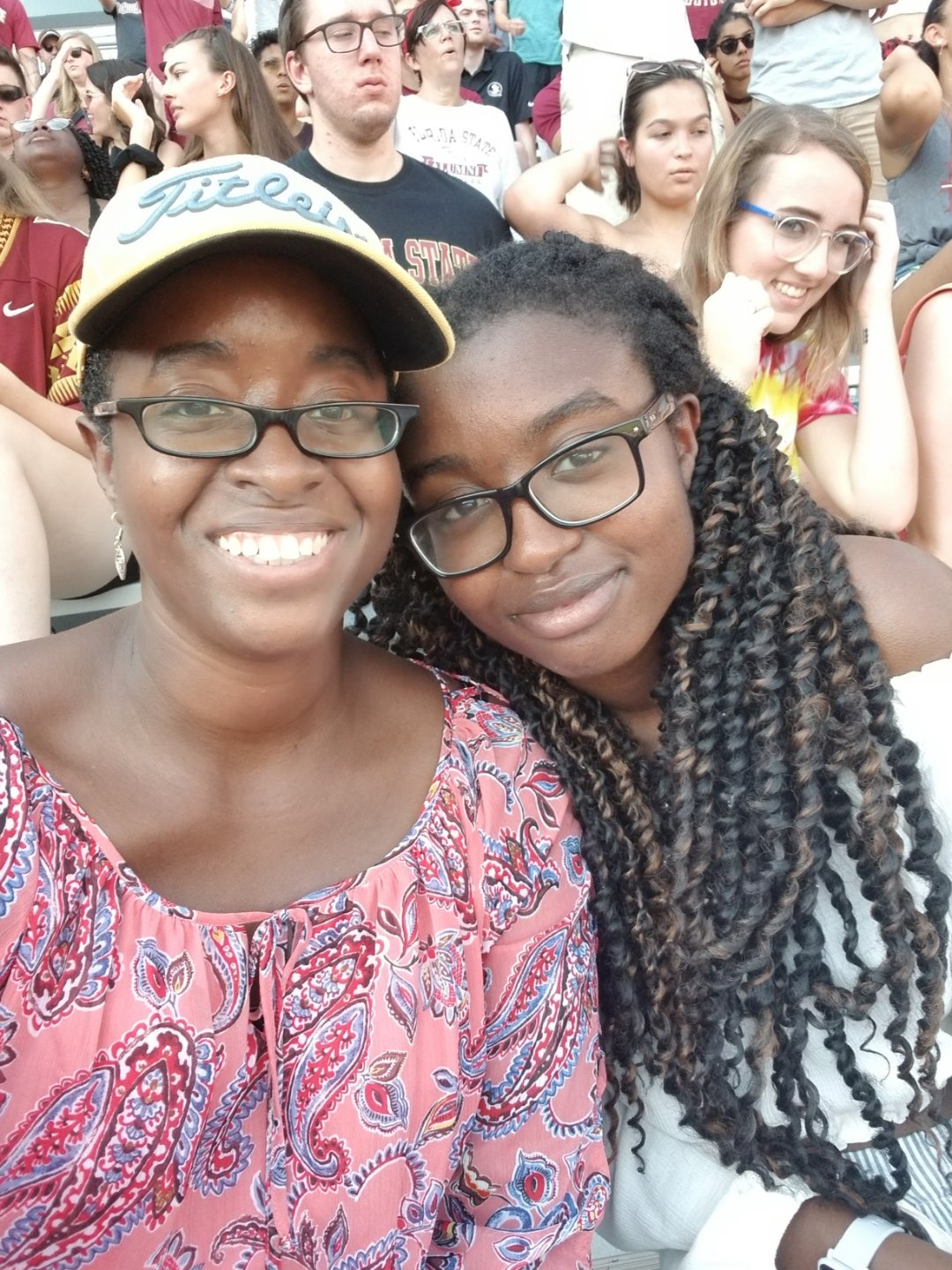Kalijah and Kisha Rahming smiling during a FSU football game