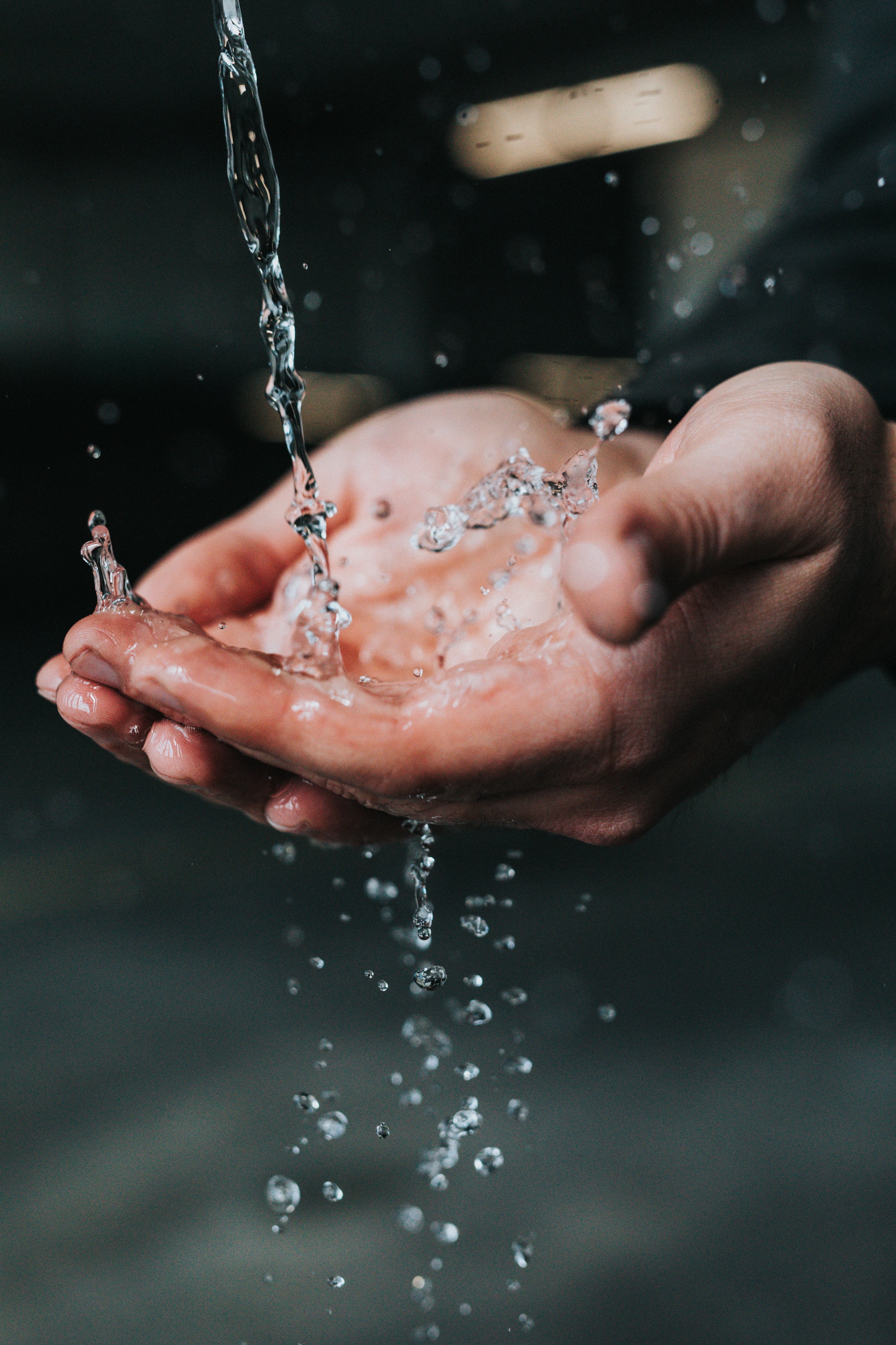 A person washing hands.