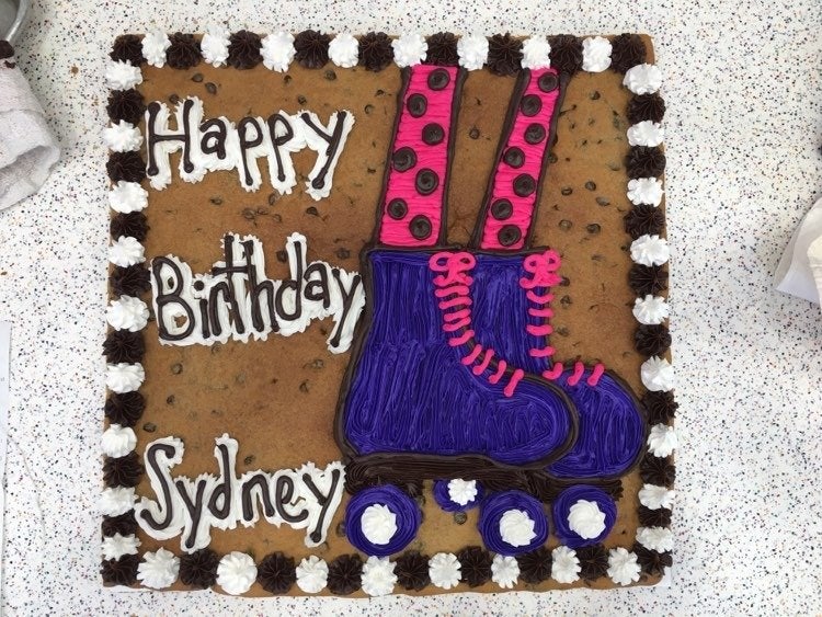 cookie cake with pink and purple roller skates