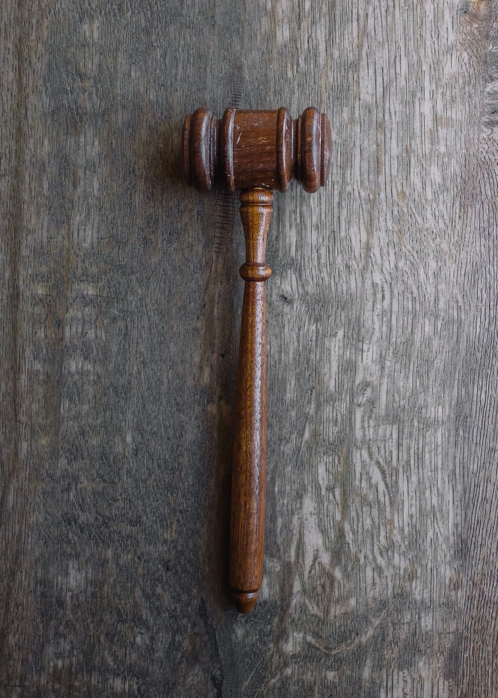 gavel sitting on a wooden table