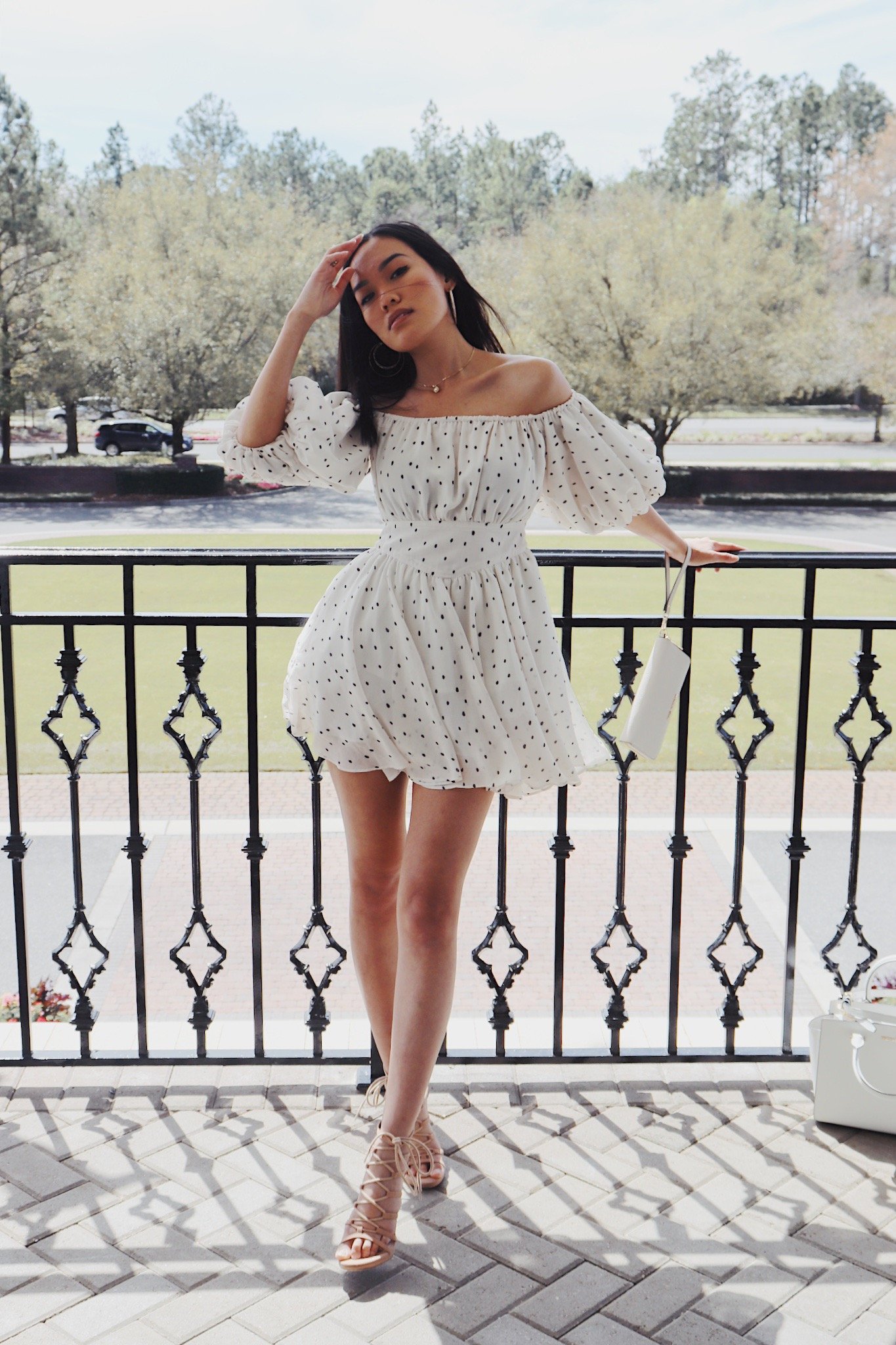 Girl posing in polka dot dress