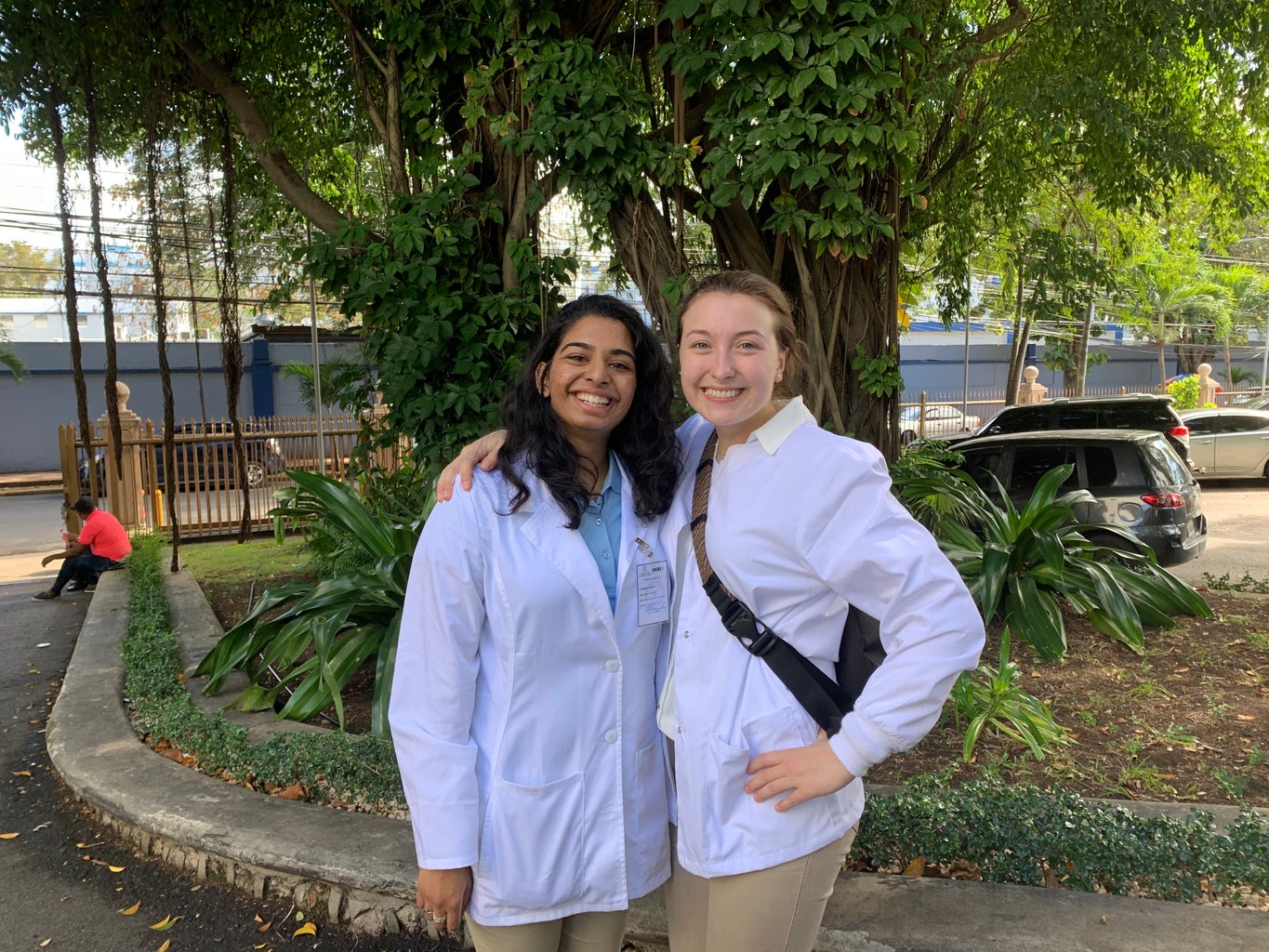 Girls with white coat outside
