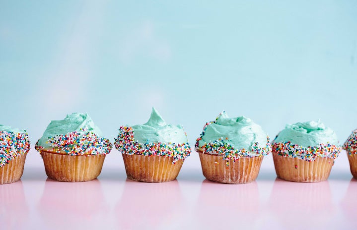 row of blue cupcakes