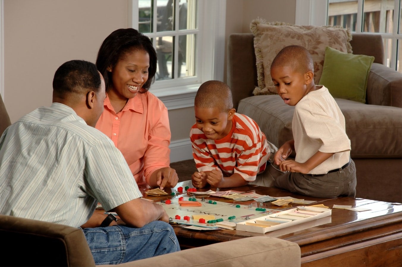 family playing board game