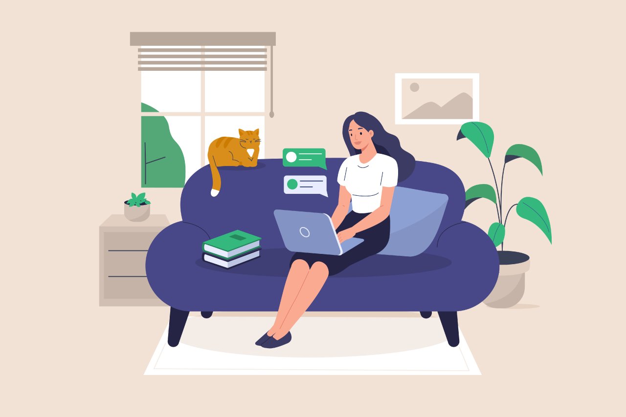 Freelance Girl Working at Home Sitting on Sofa with Laptop and Cat
