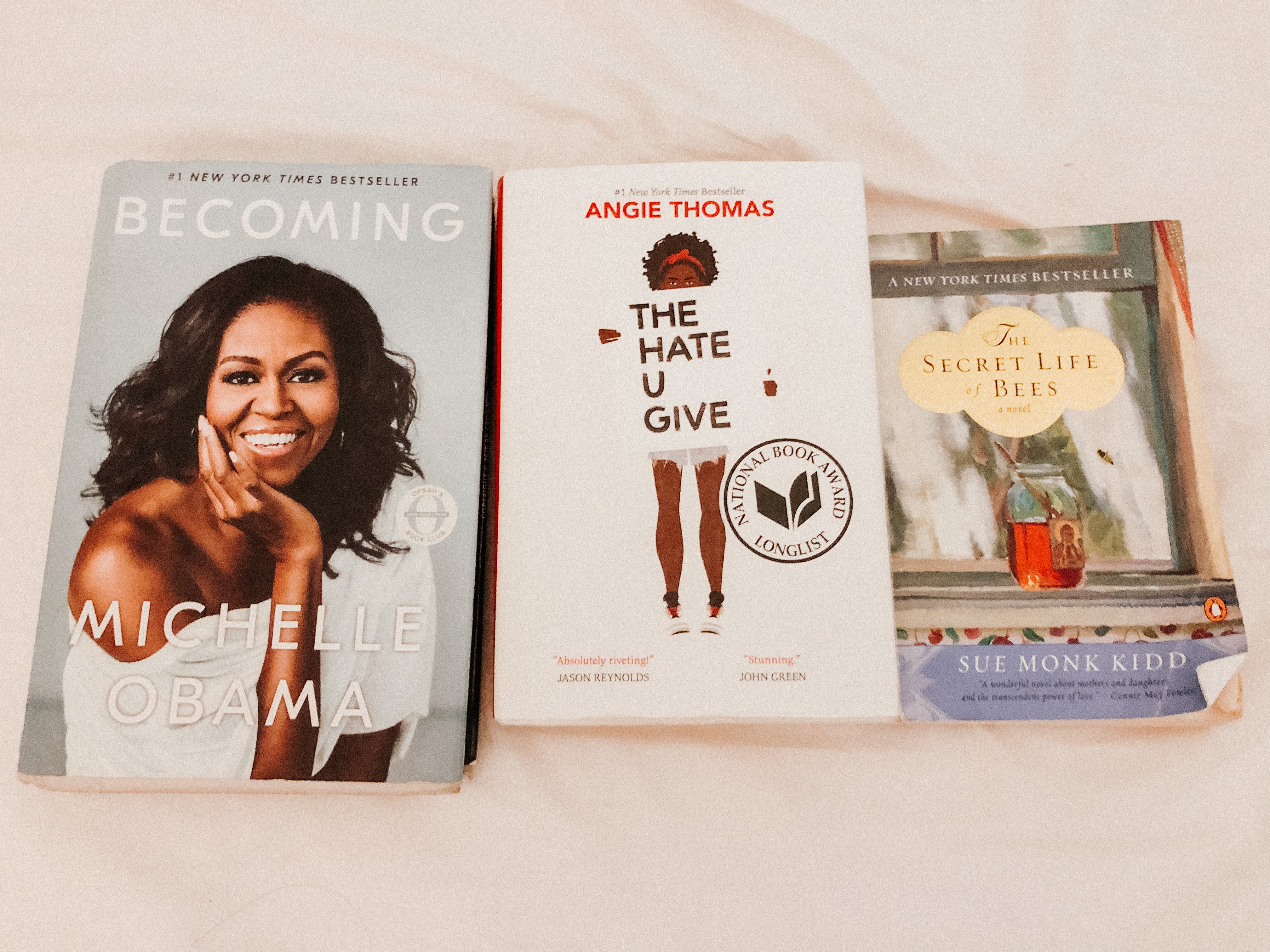 reading books: becoming by michelle obama, the hate u give by angie thomas, the secret life of bees by sue kidd