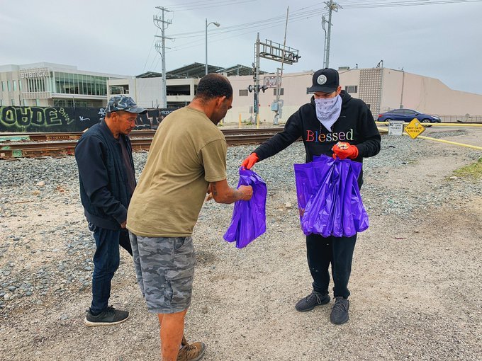 elijah handing out suppliesjpegjpg by Elijah Daniel?width=698&height=466&fit=crop&auto=webp&dpr=4