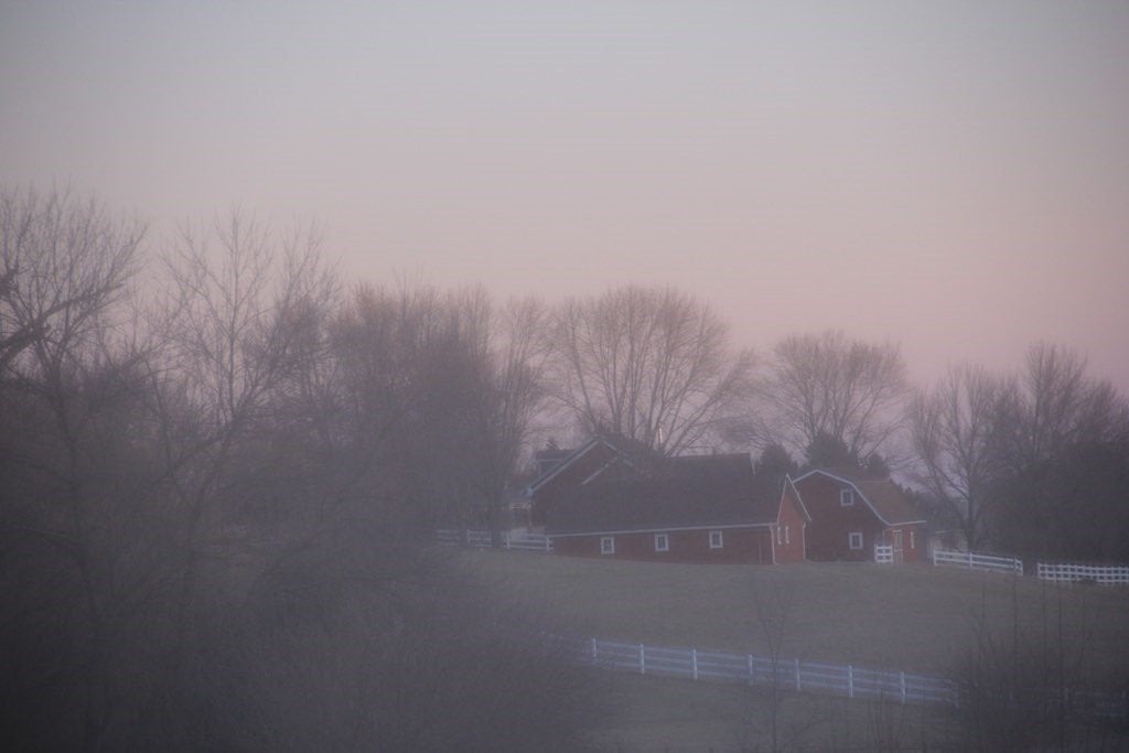 A red farm in the distance.
