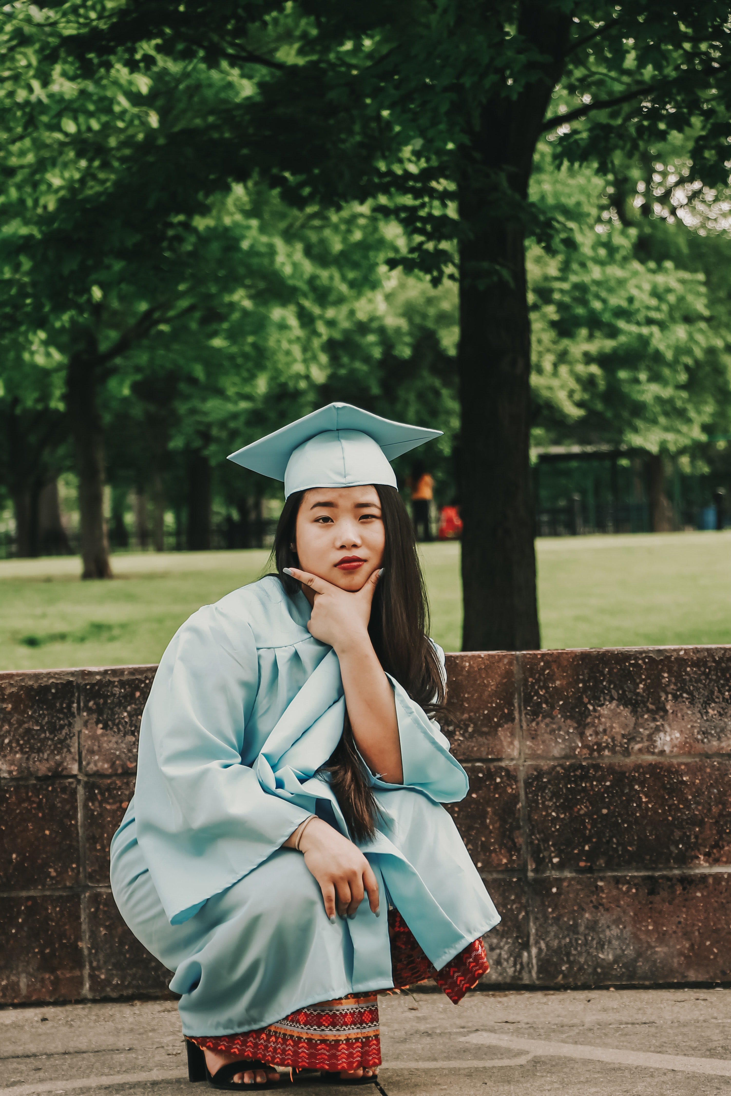crouching woman wearing blue academic gown and hat 2335156?width=698&height=466&fit=crop&auto=webp&dpr=4