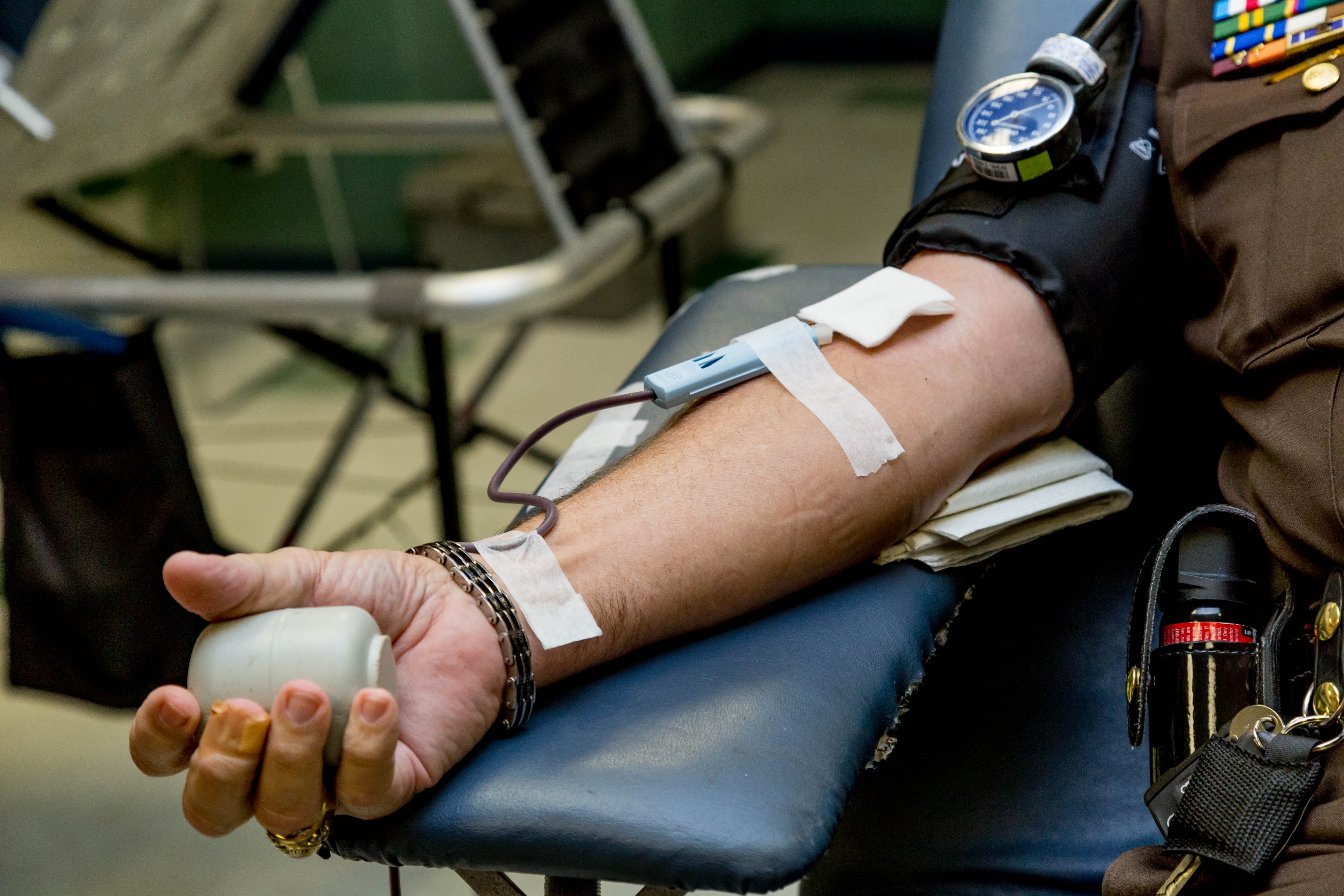 Person sitting in chair donating blood