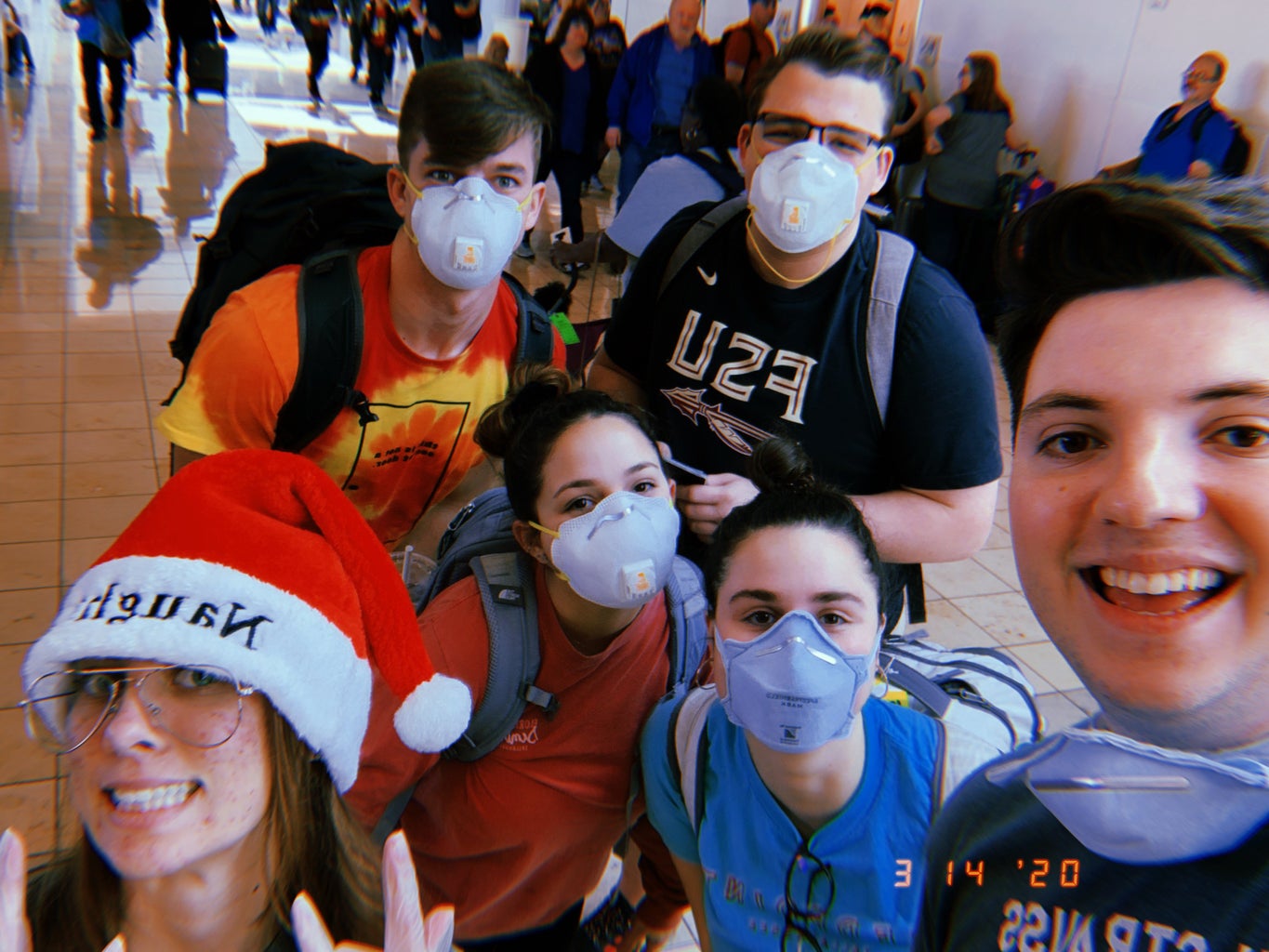 My friends and I in masks at the airport