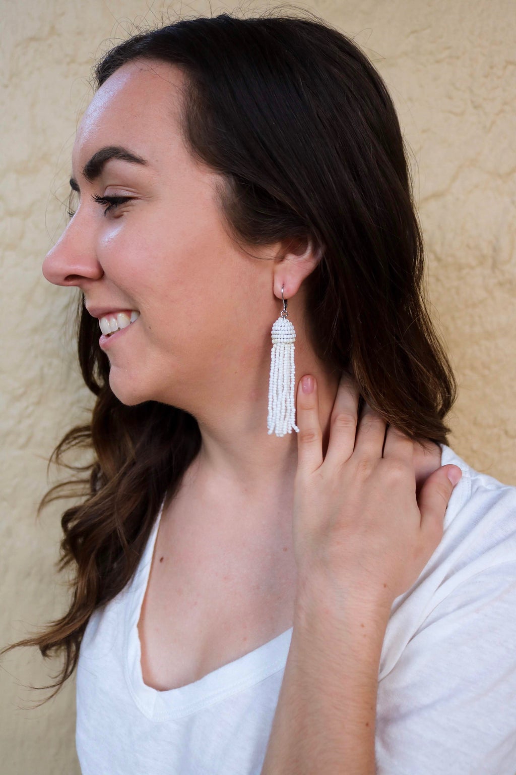 girl wearing white earrings