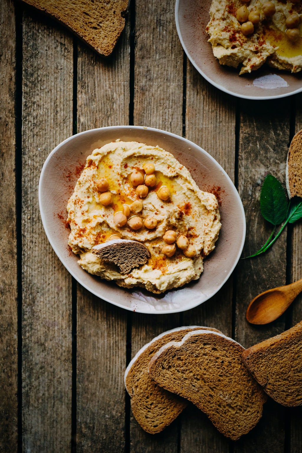 hummus with chickpeas and bread on the side