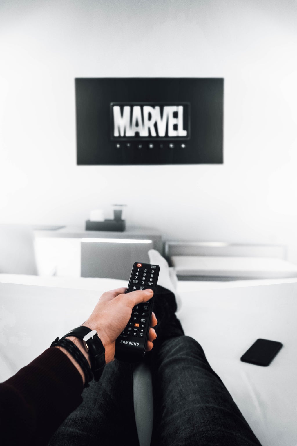 person watching Marvel on TV