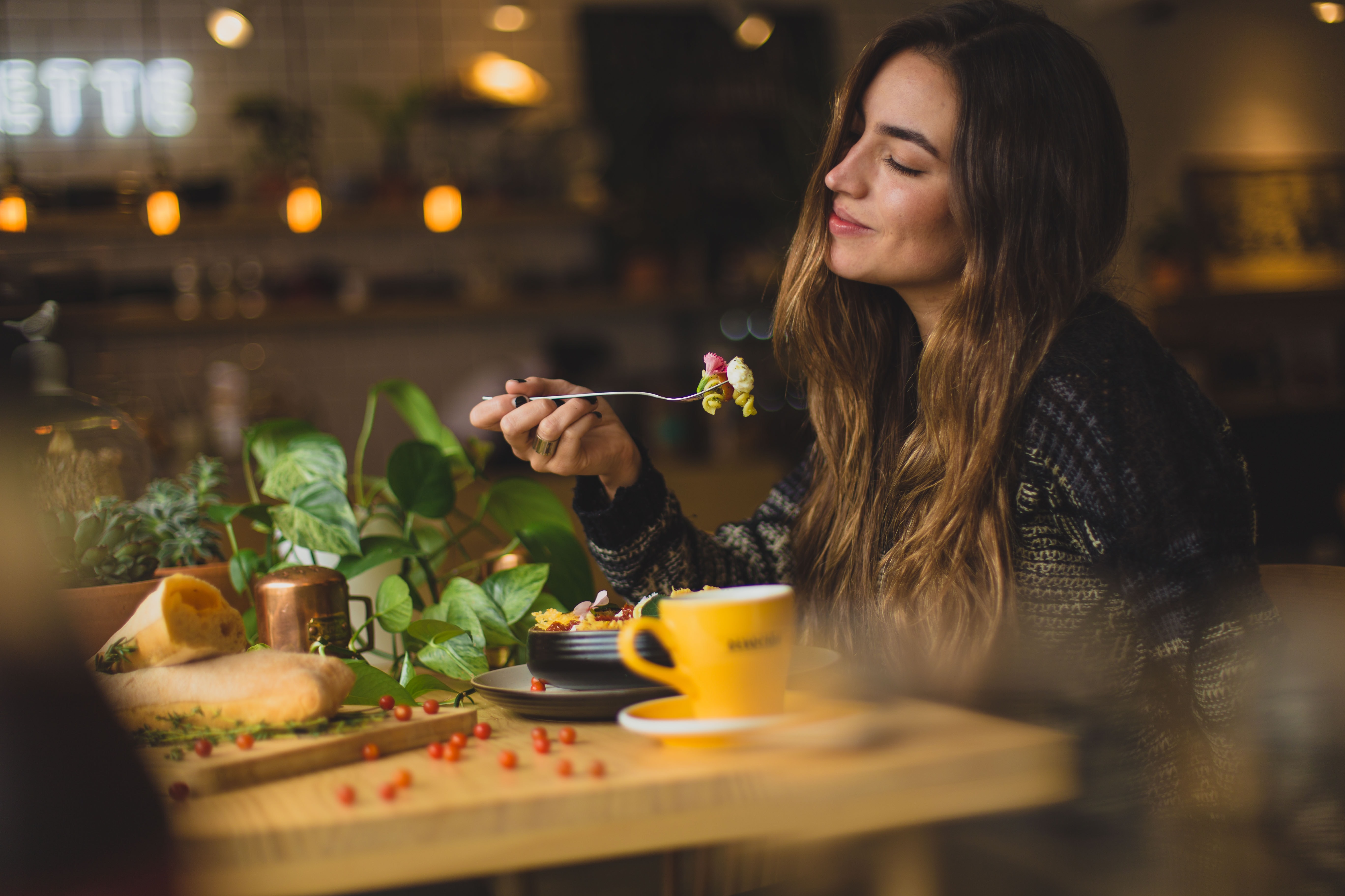 woman eating at dinner table
