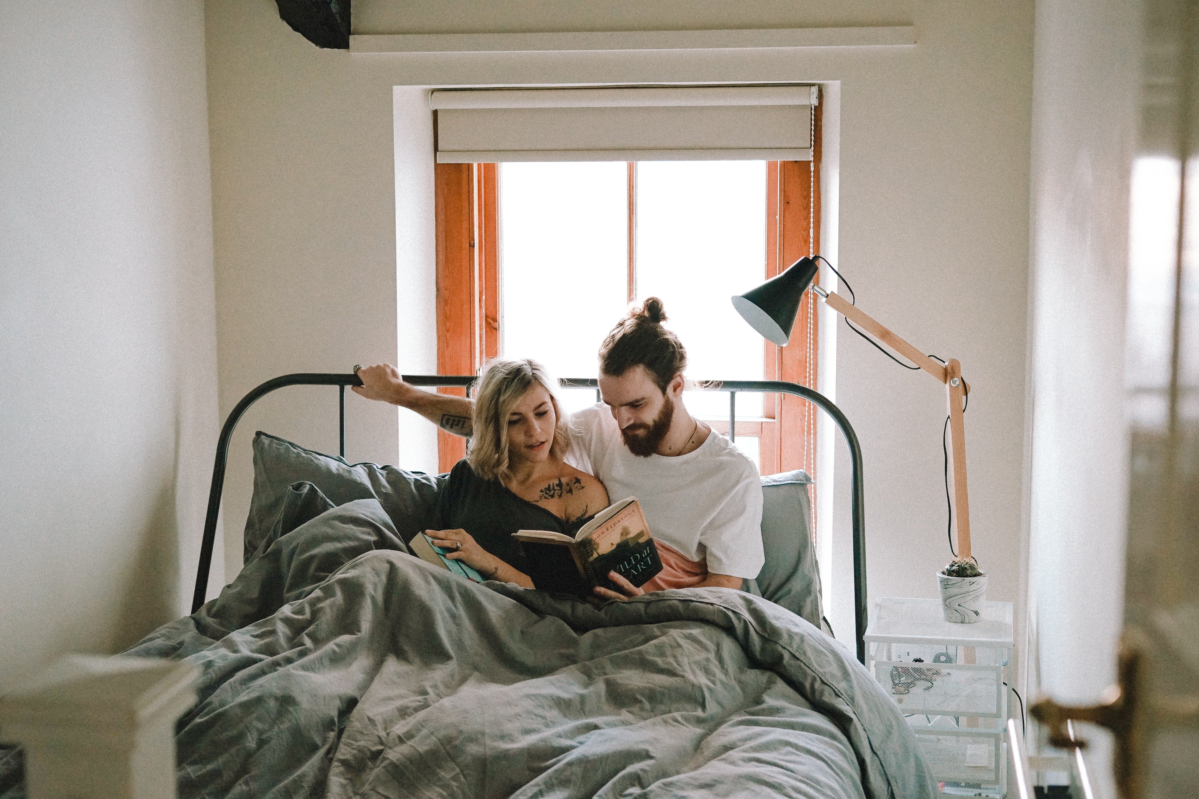 man and woman reading in bed?width=1024&height=1024&fit=cover&auto=webp&dpr=4