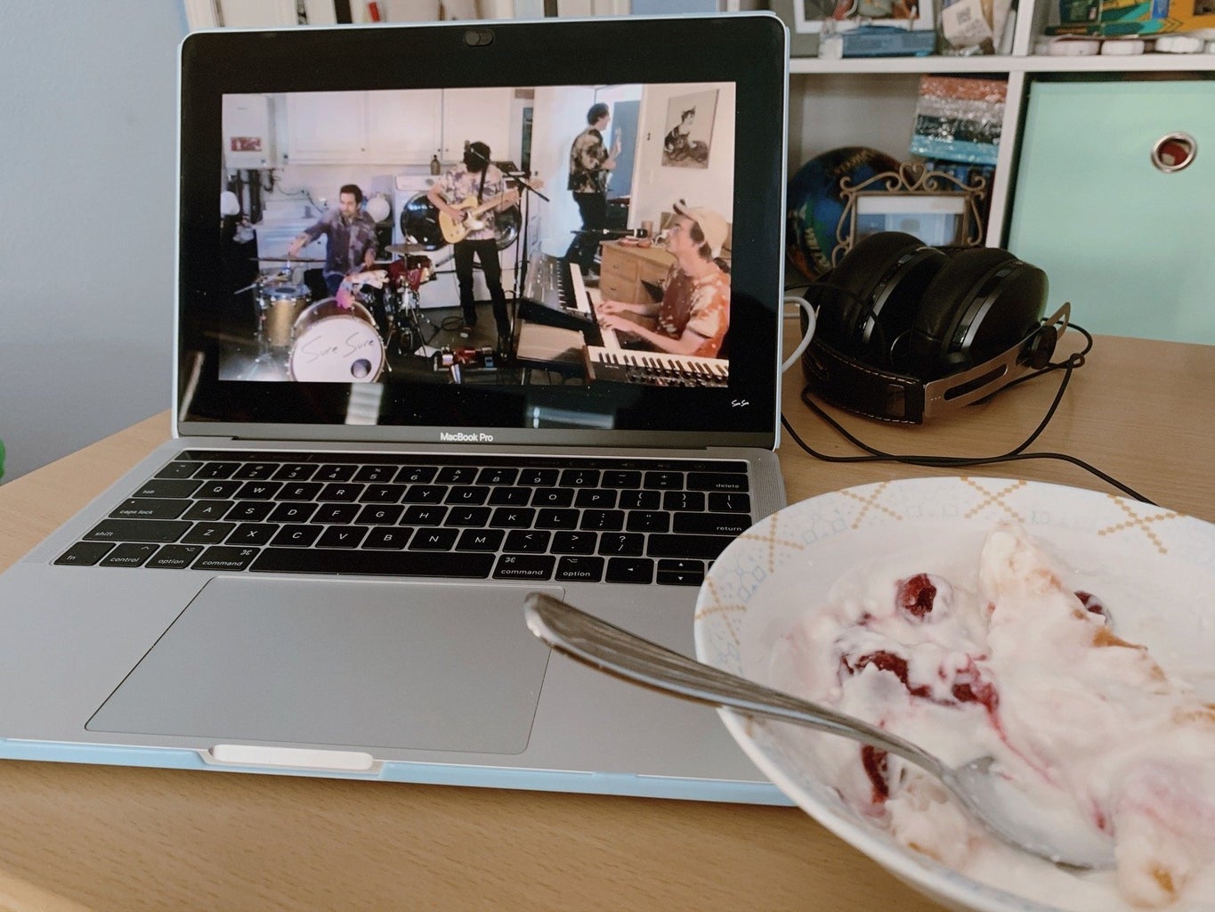 concert being streamed on a computer with a bowl of yogurt on the side