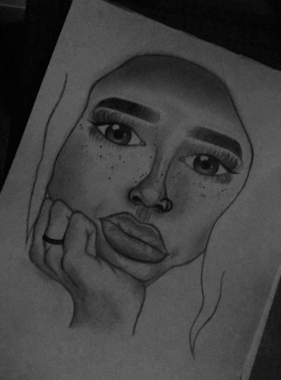 b&w image of a girl resting her chin in her hand