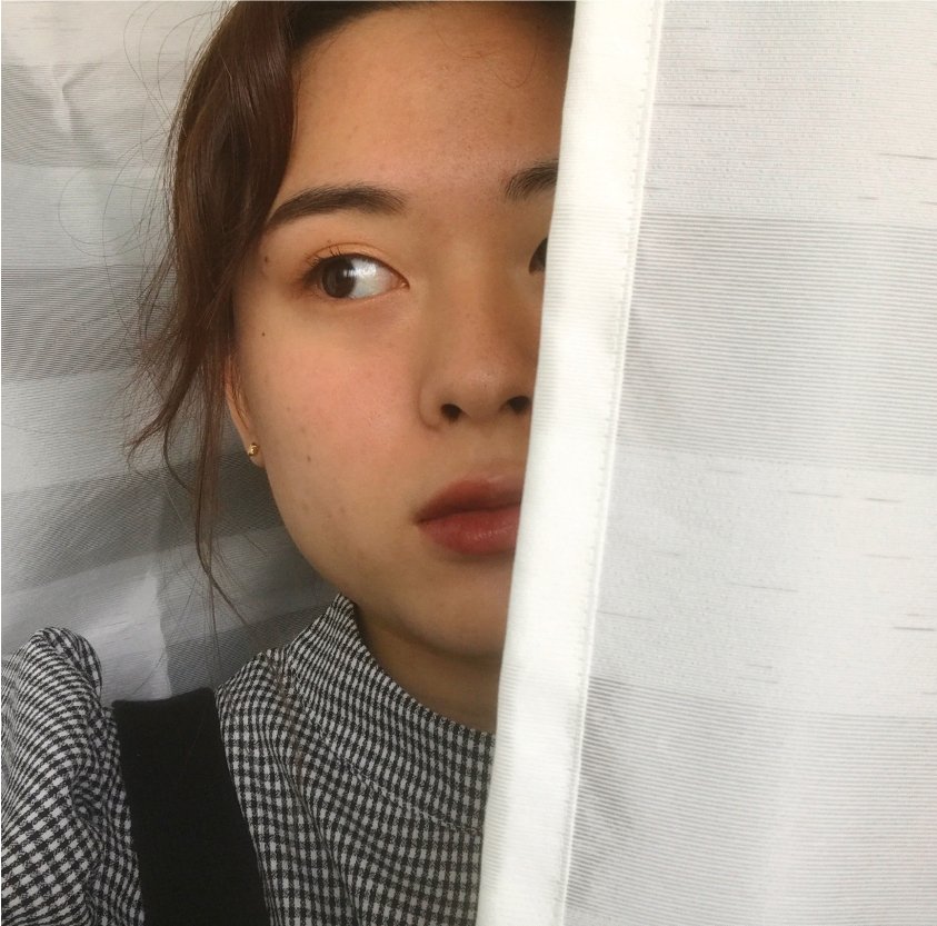 Power of makeup, showing half of face with makeup, hiding the other half with a curtain.