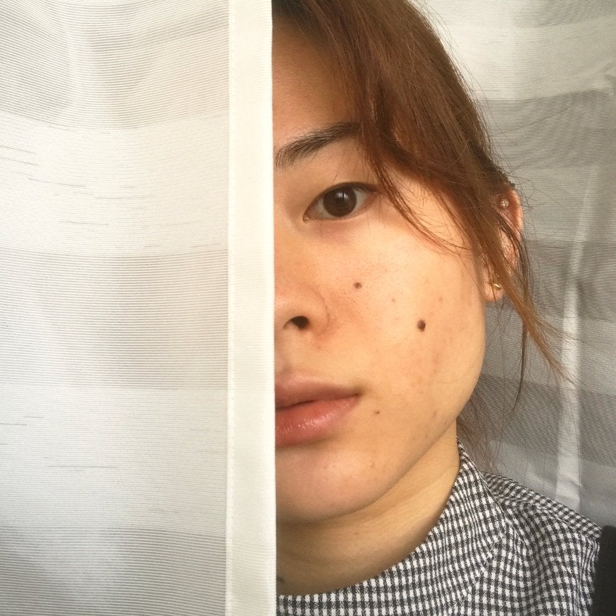 power of makeup, chapter member showing half of her bare face, other half covered with a curtain