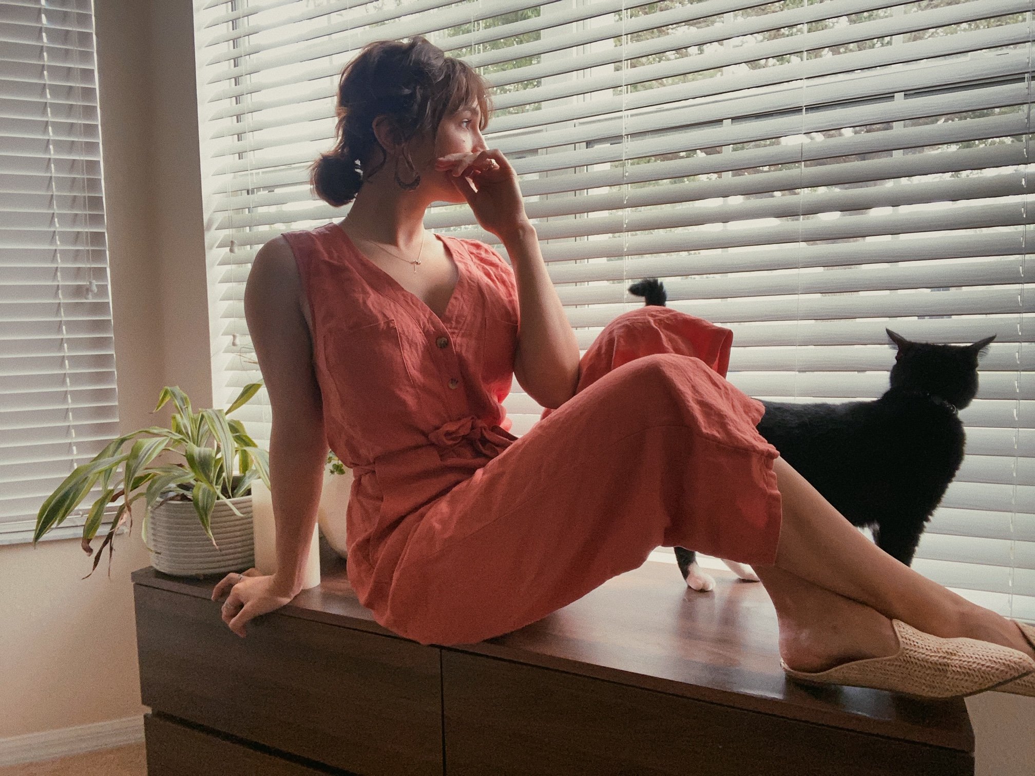 girl sitting on windowsill