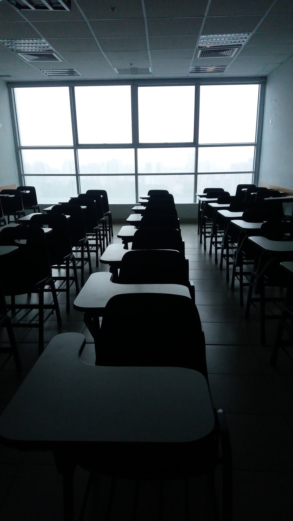 empty desks in a dark room