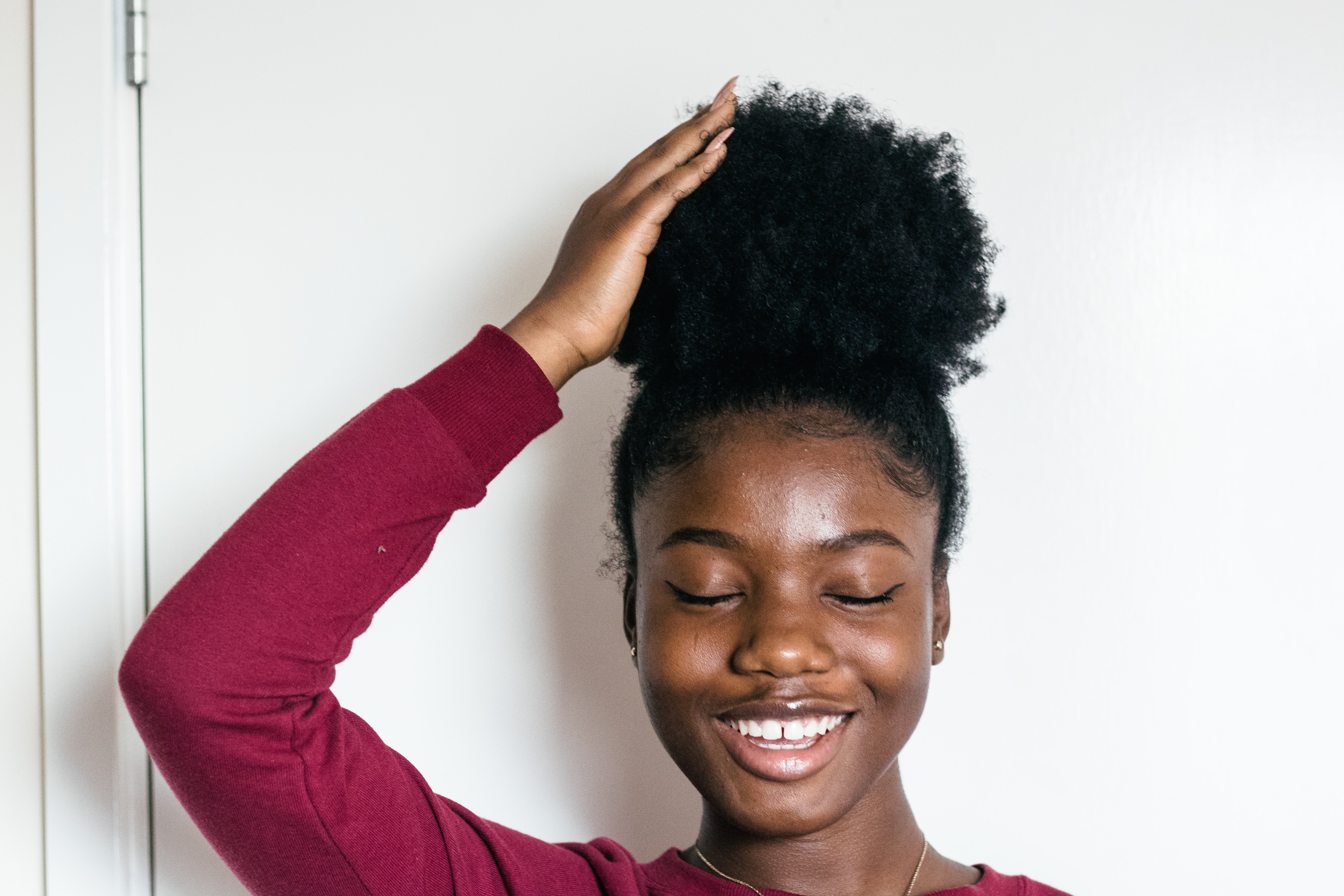 woman touching natural hair