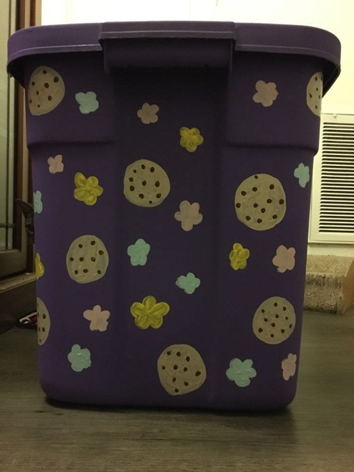 painted side of a storage container with flowers and cookies
