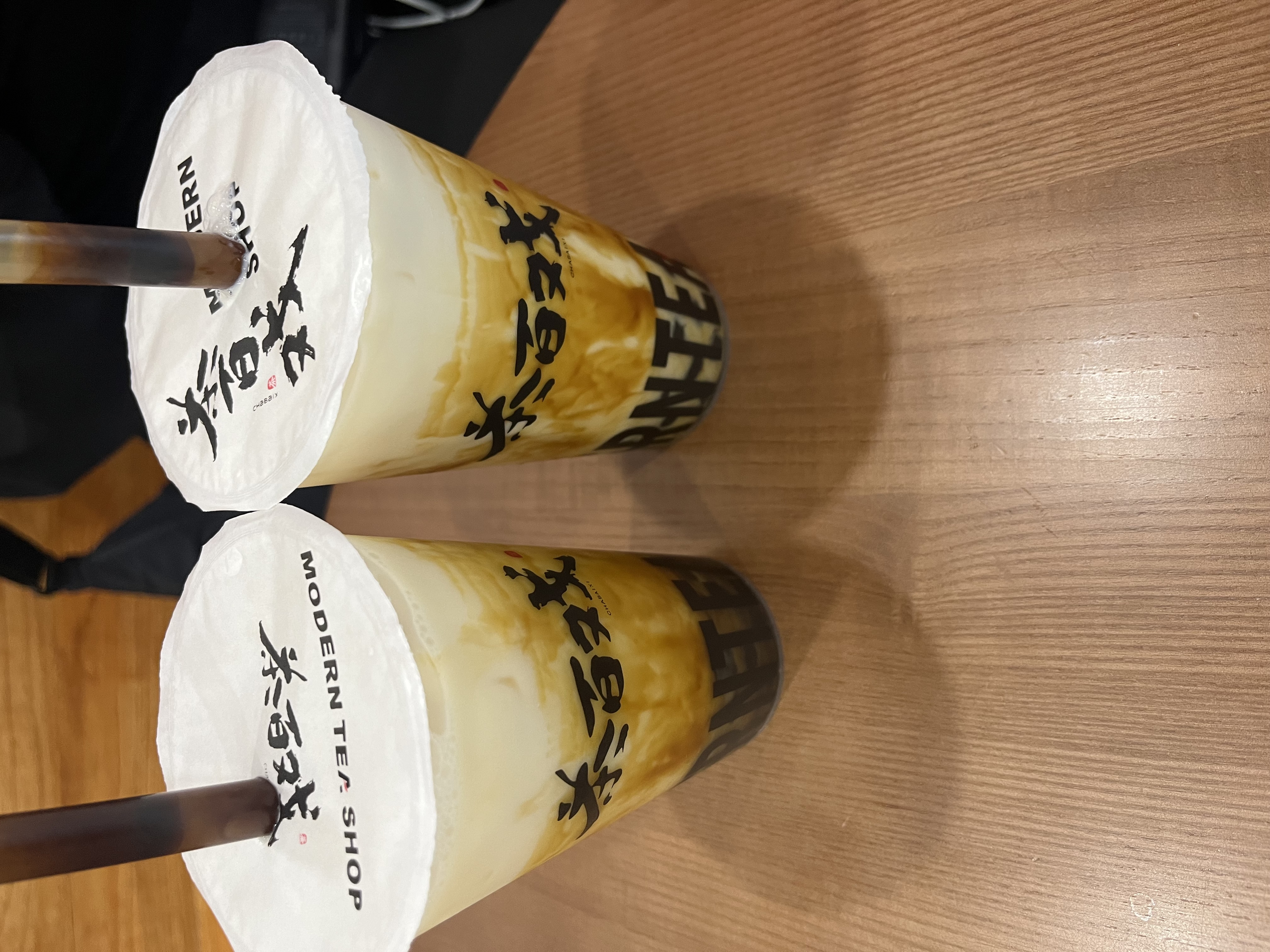 Two colourful drinks sit on a table