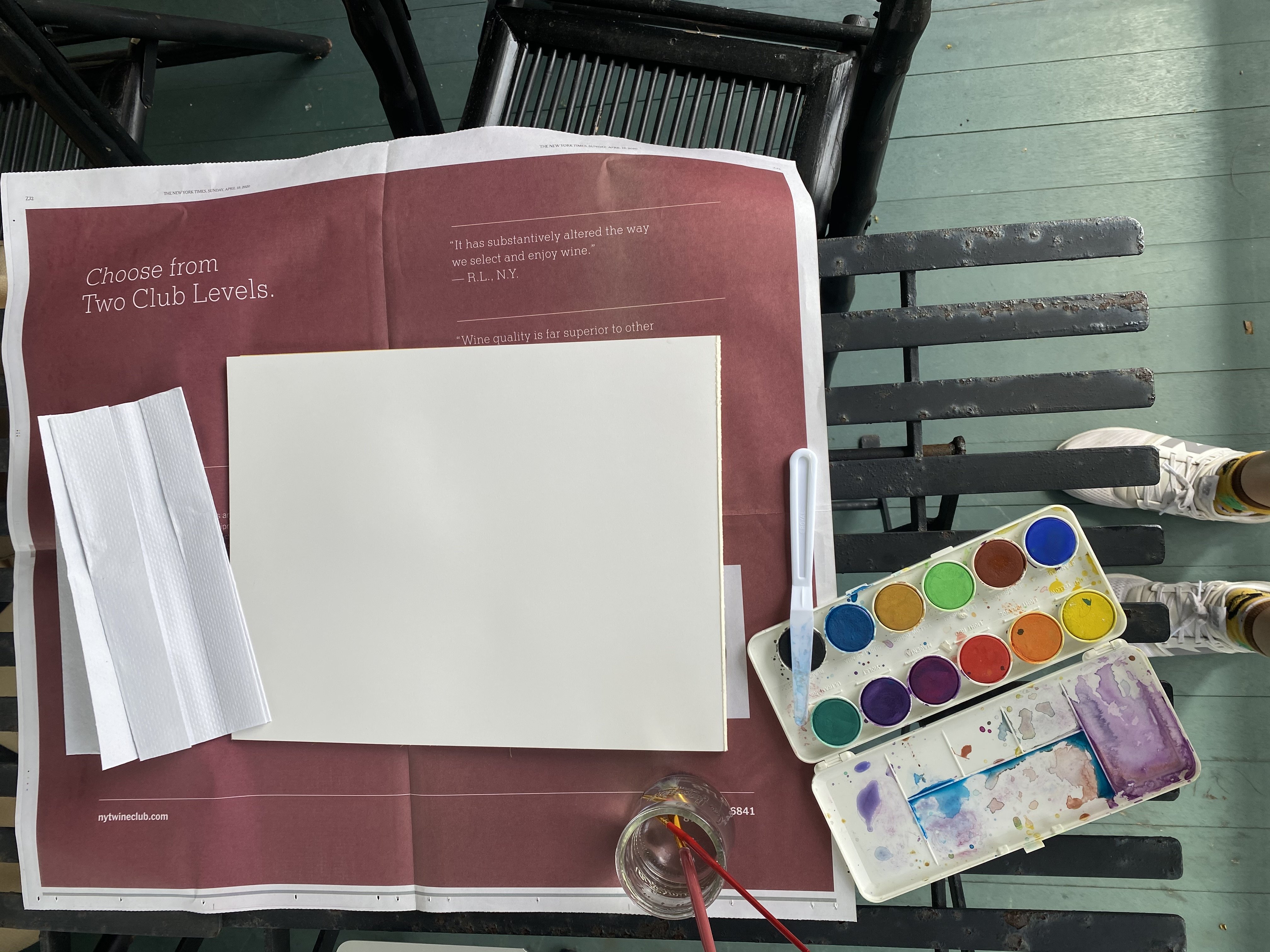 Paint and blank canvas on table