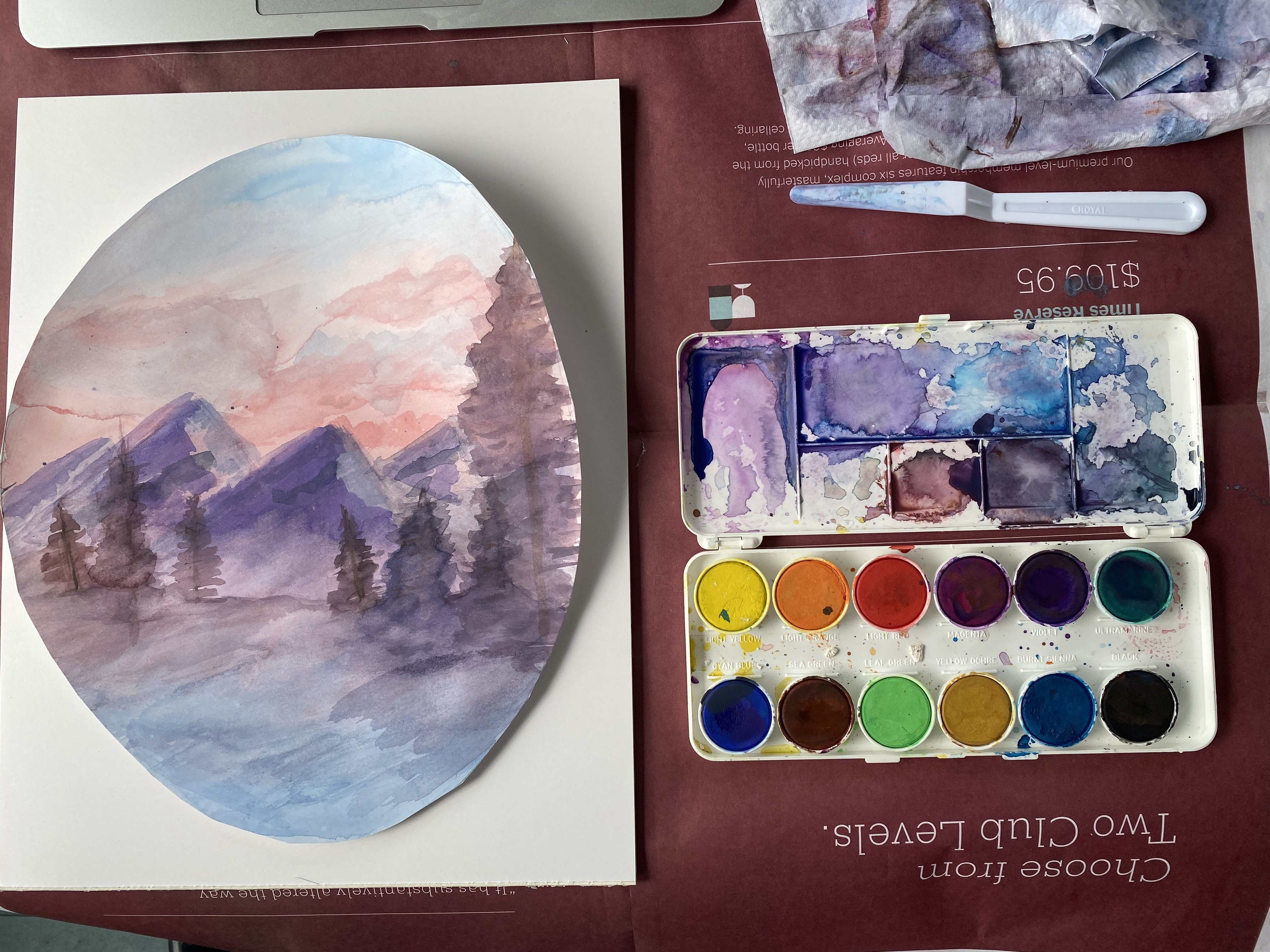 a painting and paint on a table