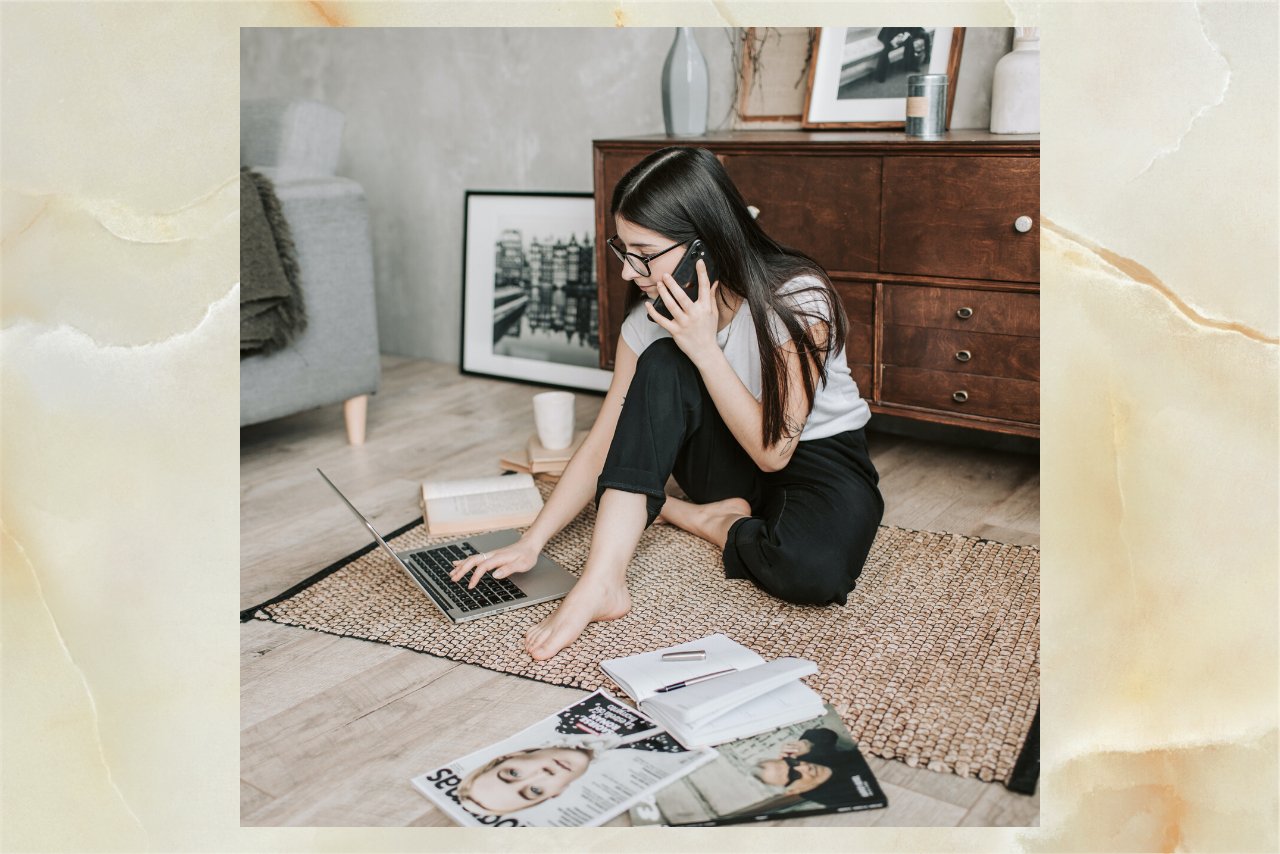 woman using phone while working on laptop?width=1280&height=854&fit=crop&auto=webp&dpr=4