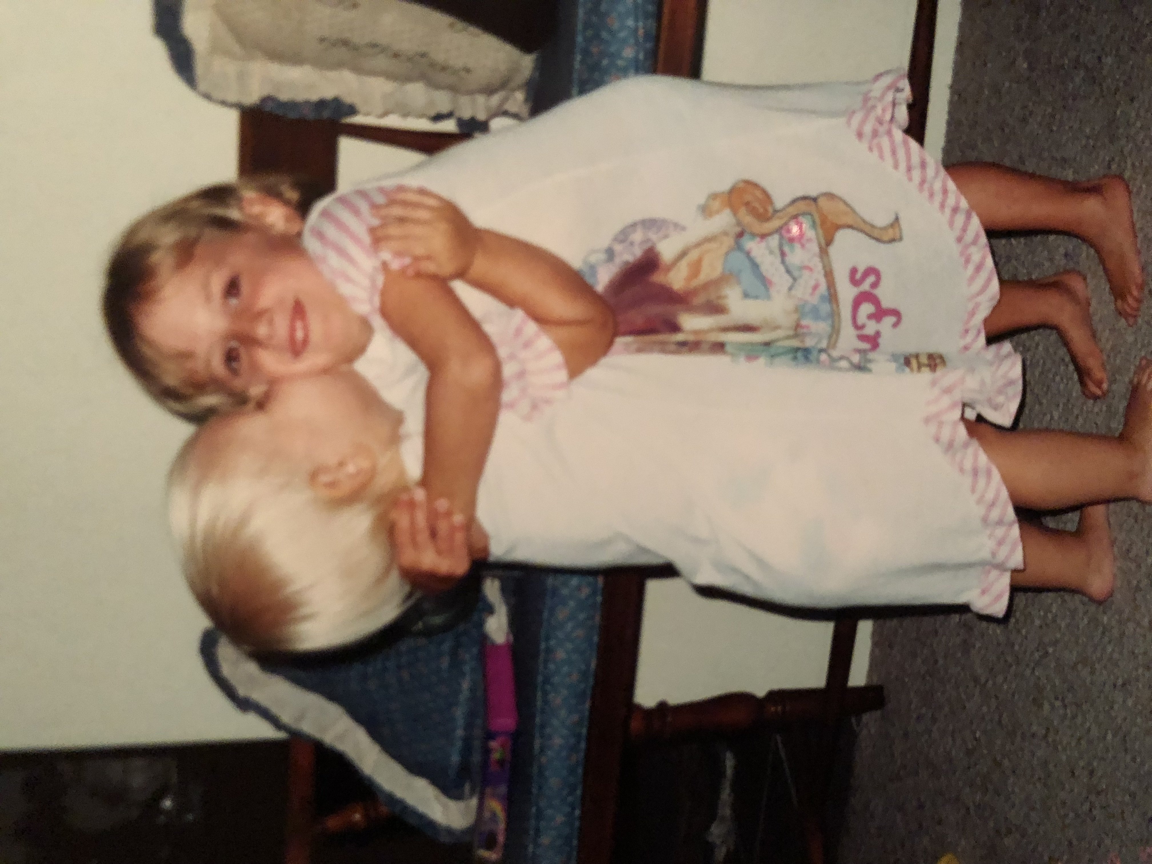 my cousin & i hugging as children