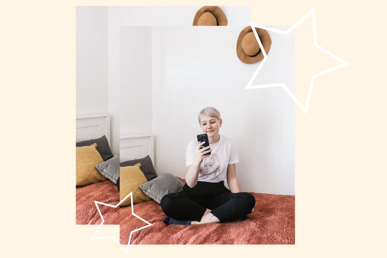 woman scrolling on phone in bed