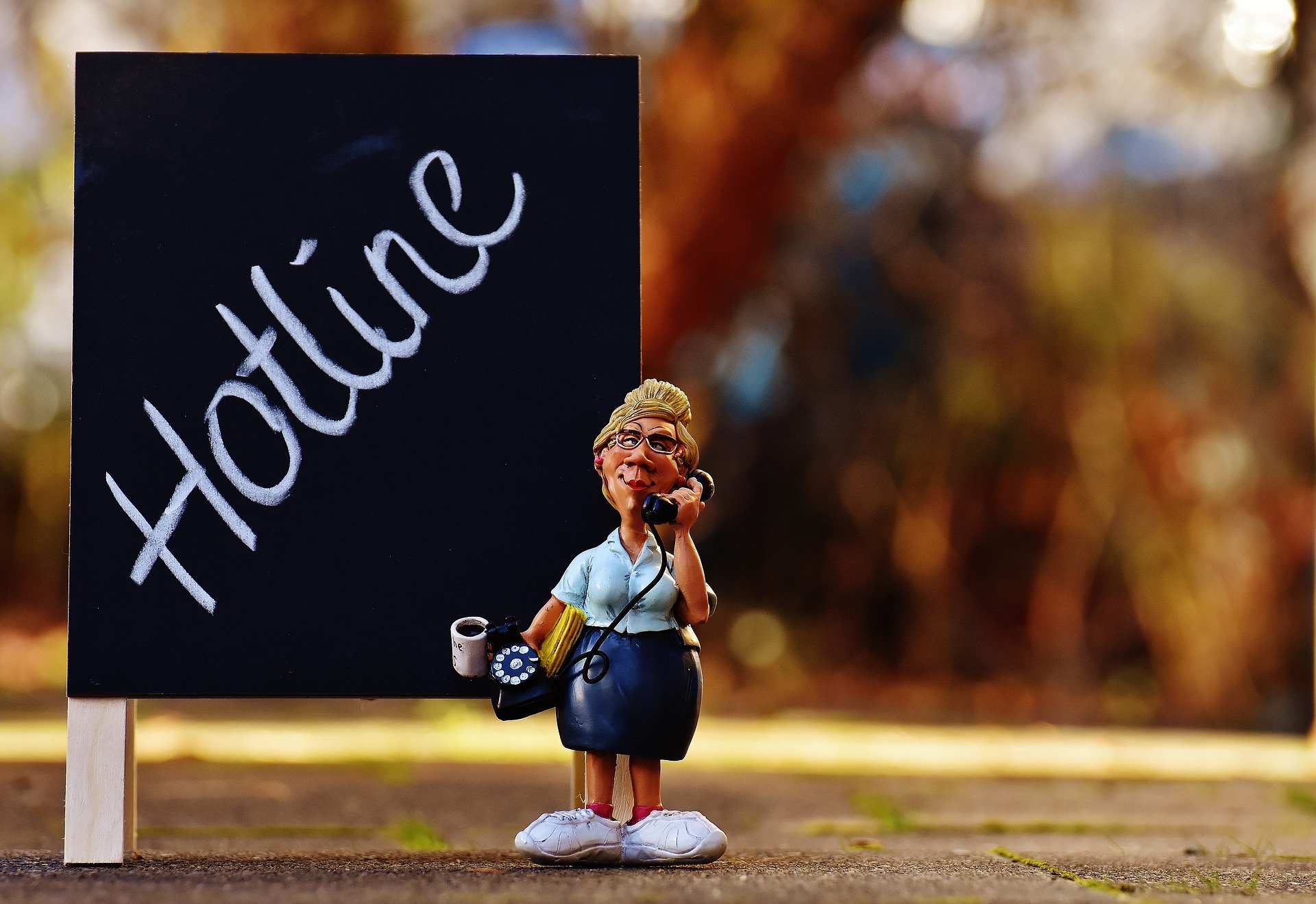 hotline sign with a secretary figurine