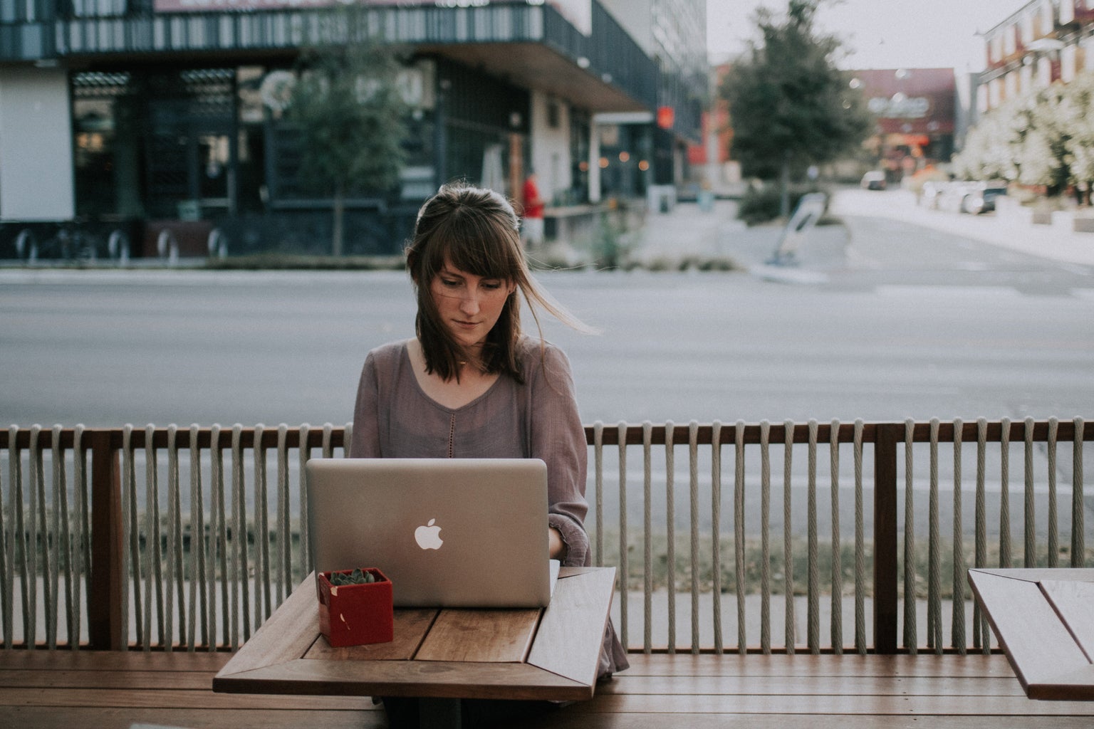 woman outside with laptop