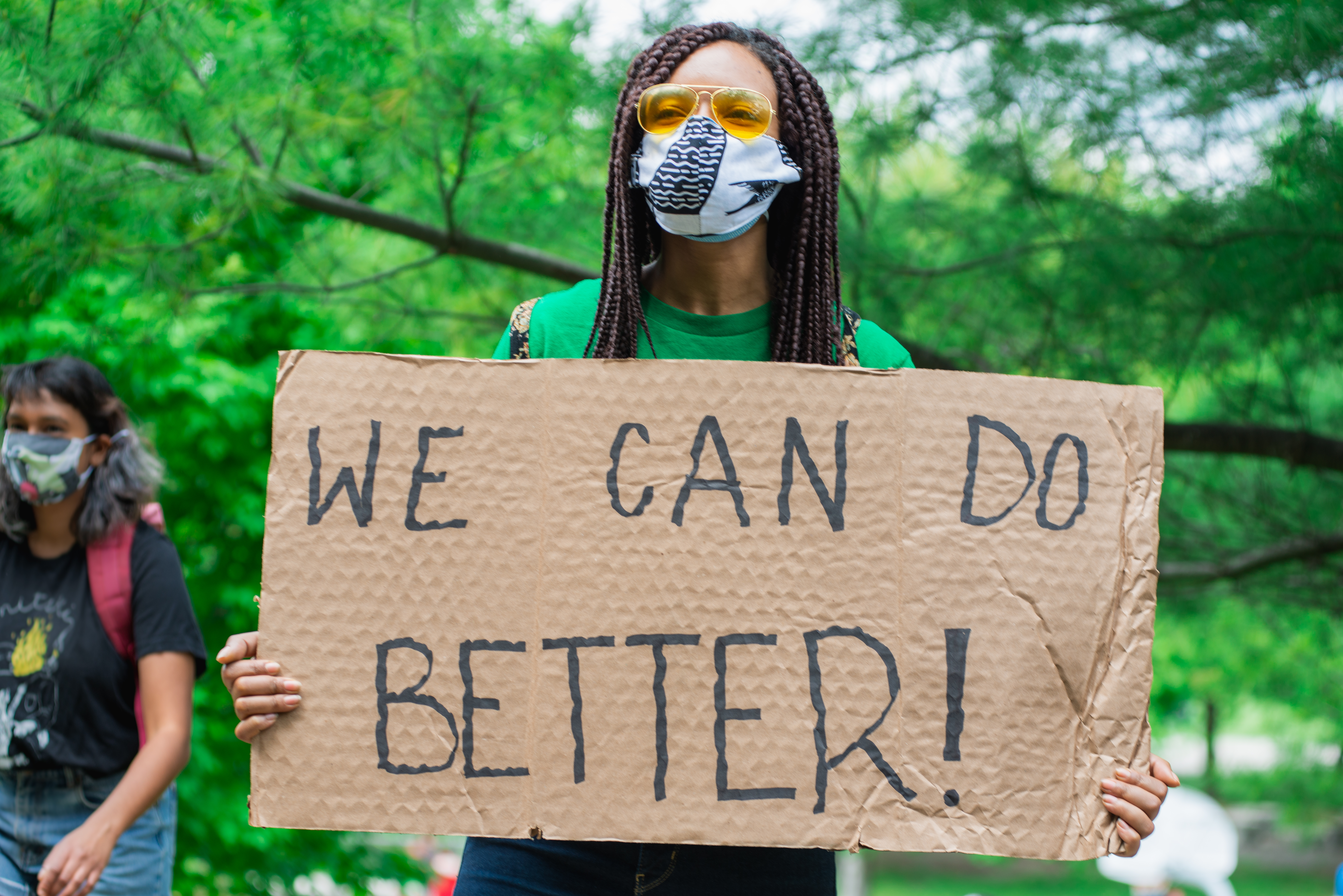 black lives matter protester holding sign
