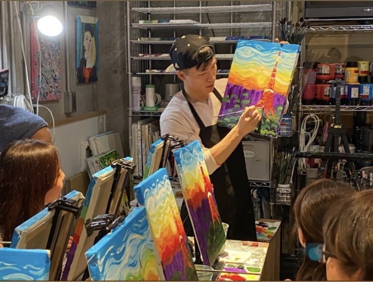 teaching painting to a few students in Tokyo