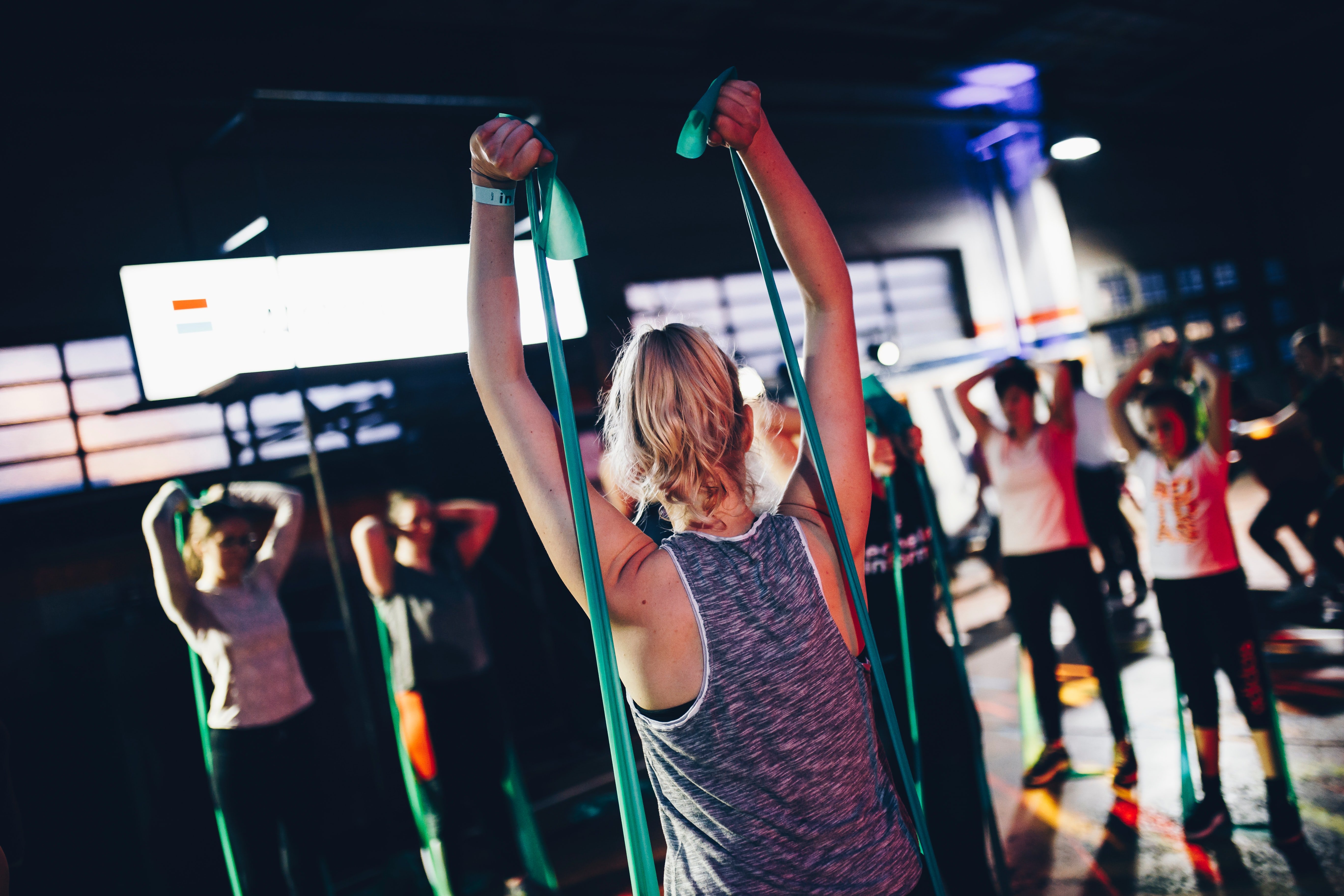 group of people in gym exercising