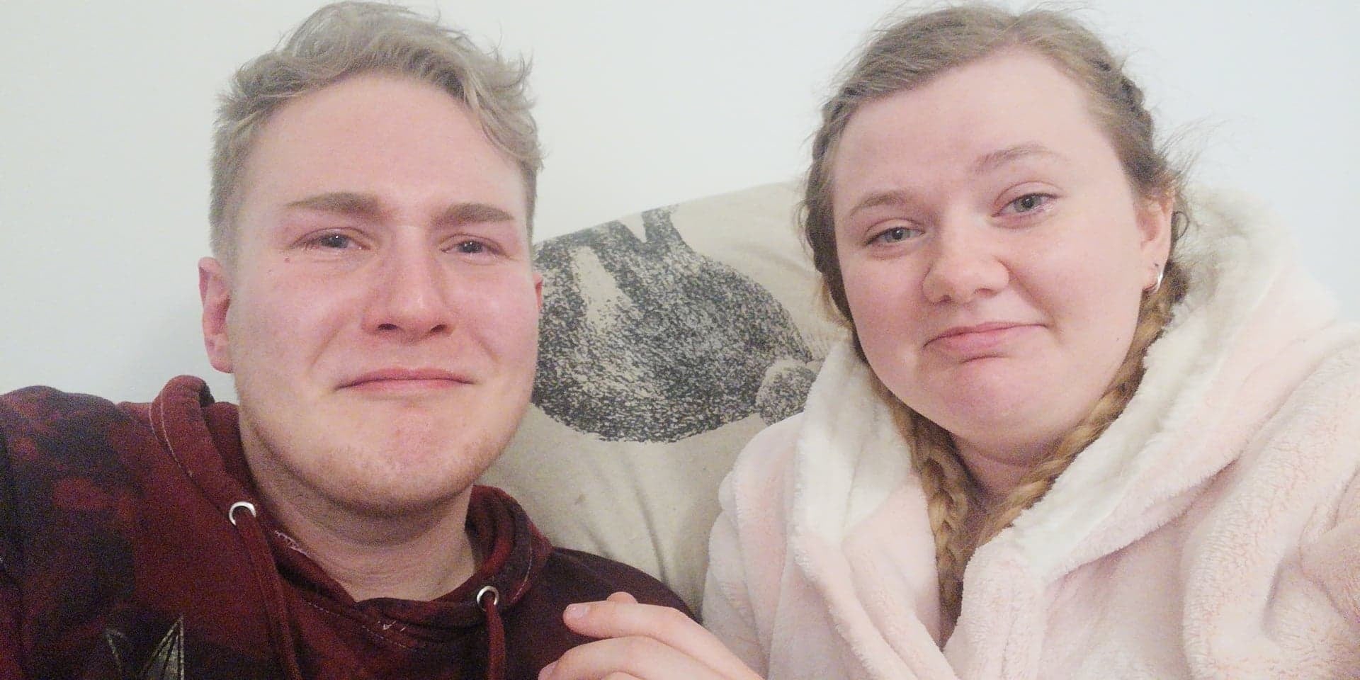 Two people crying after watching a tv show