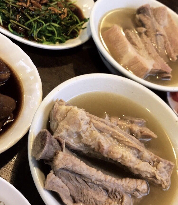 white plates of meat in broth