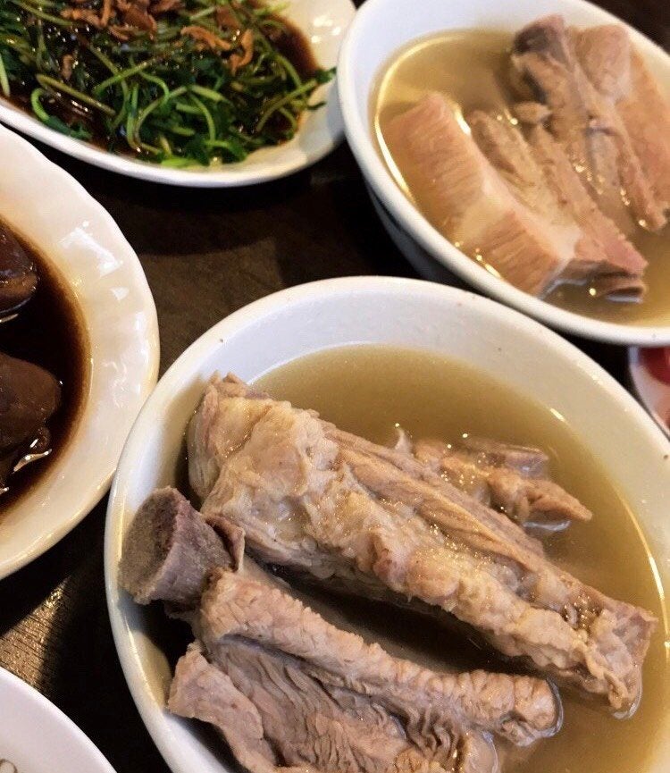 white plates of meat in broth